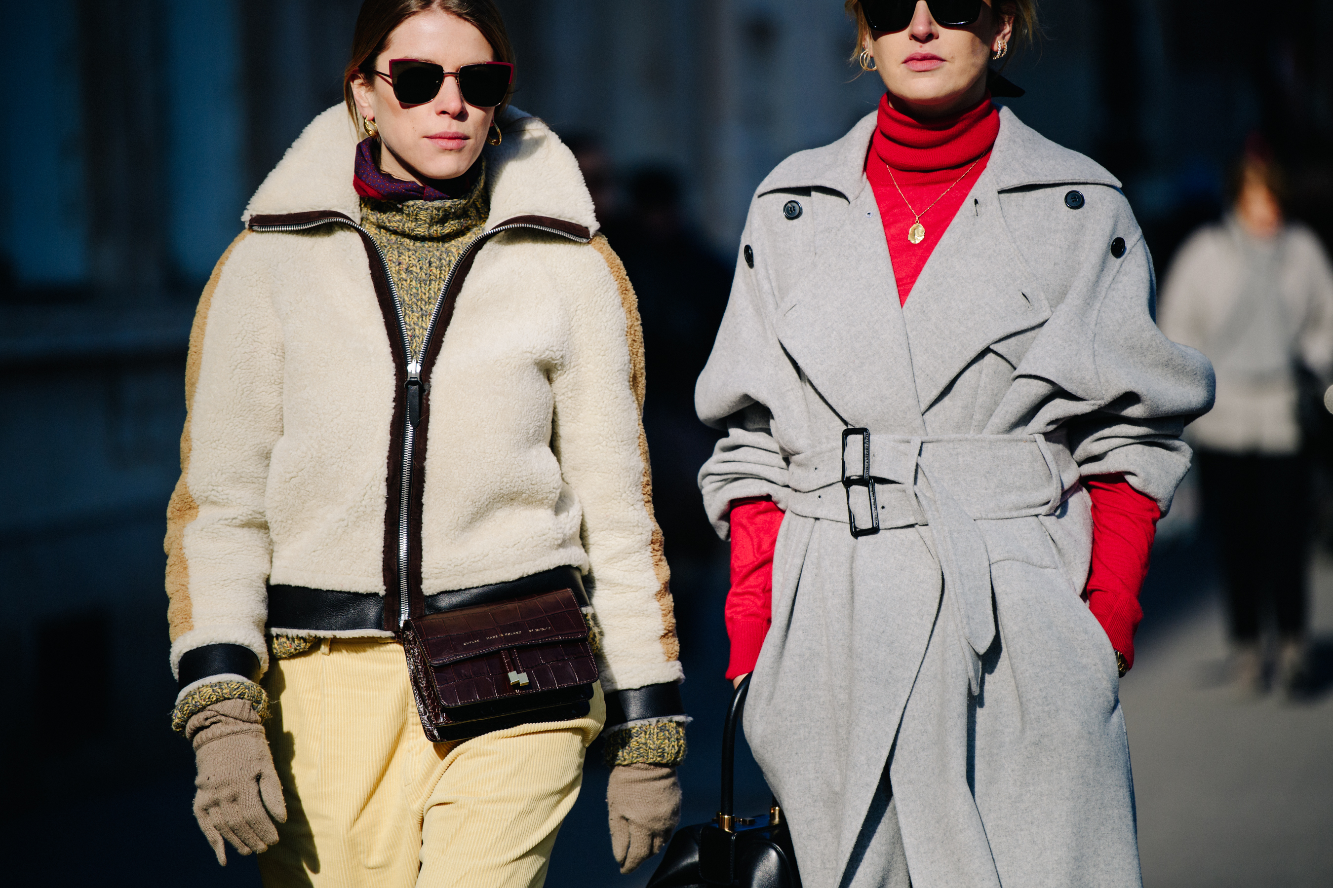Two women wearing thick winter outfits