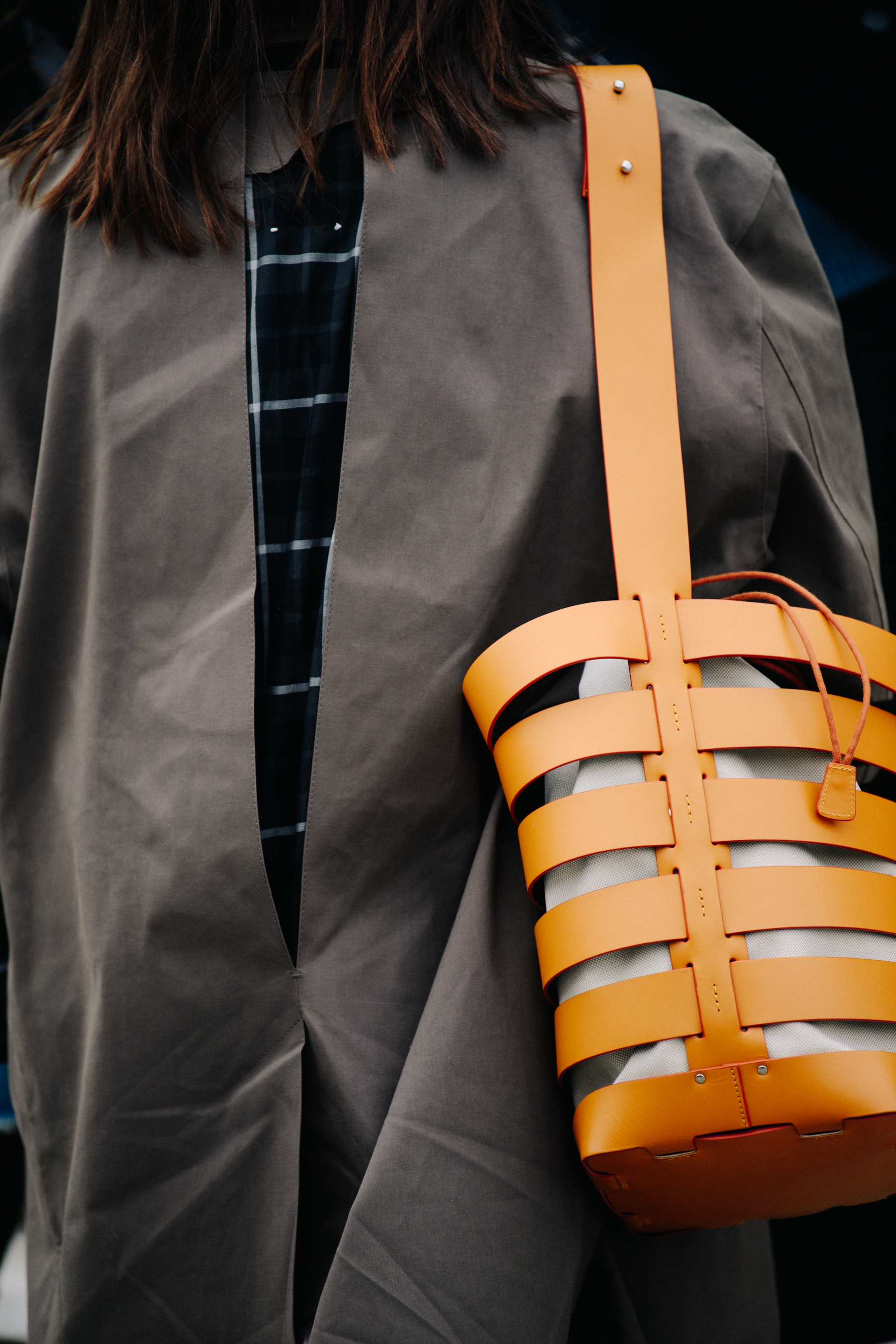 Woman carrying yellow leather bag
