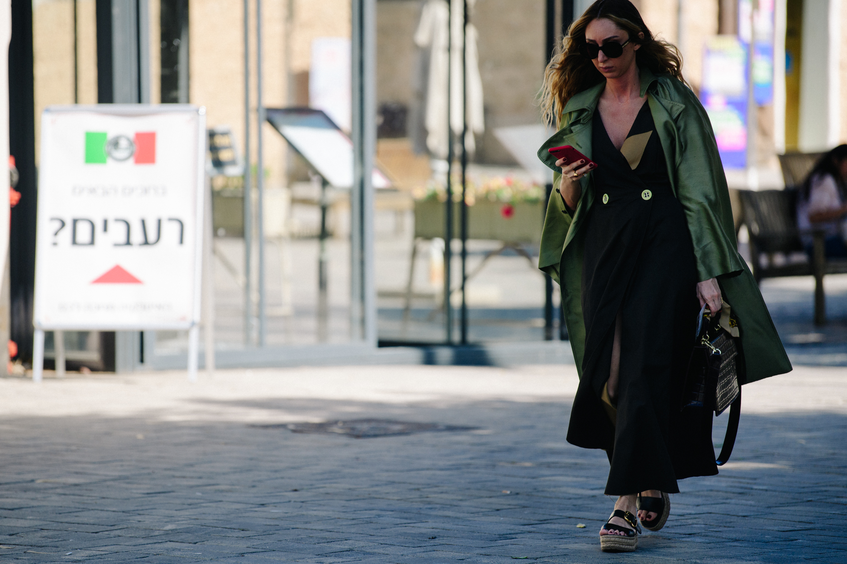Woman wearing green overcoat