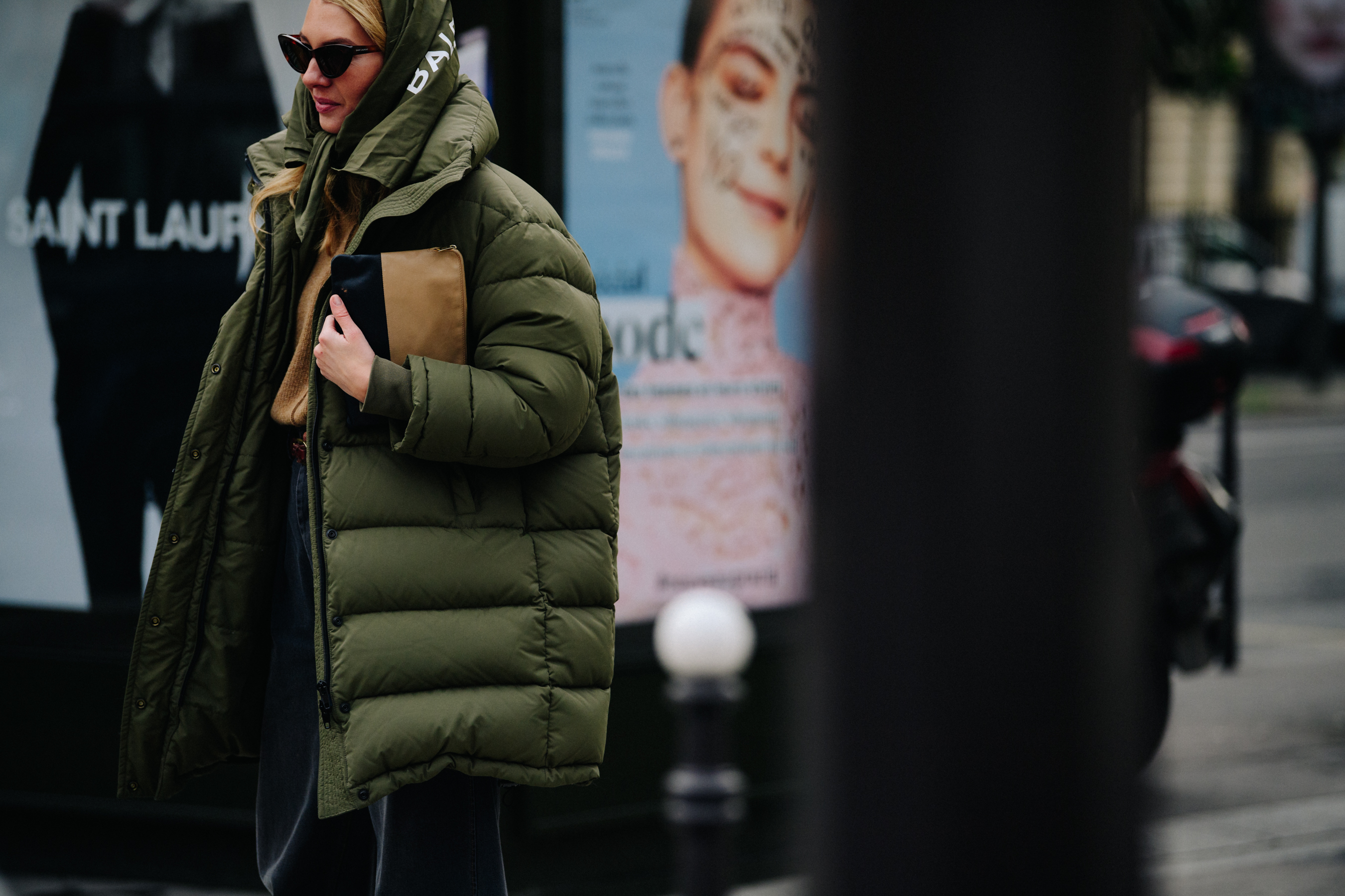 Woman wearing green Balenciaga coat