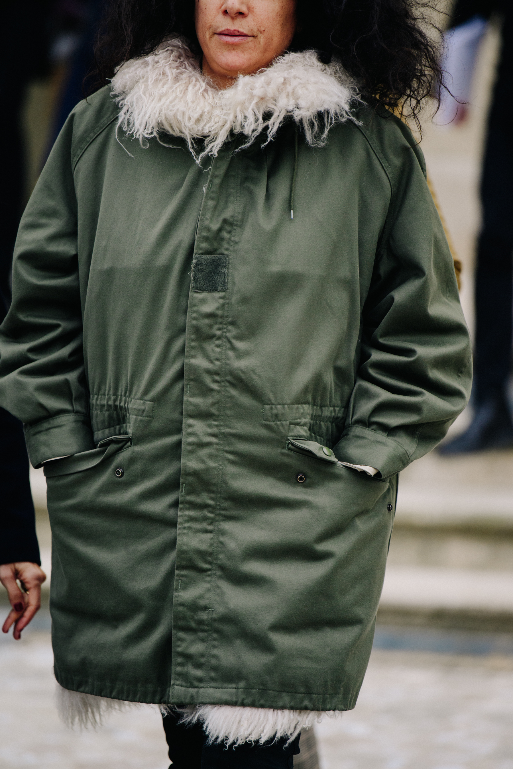 Woman wearing green military jacket