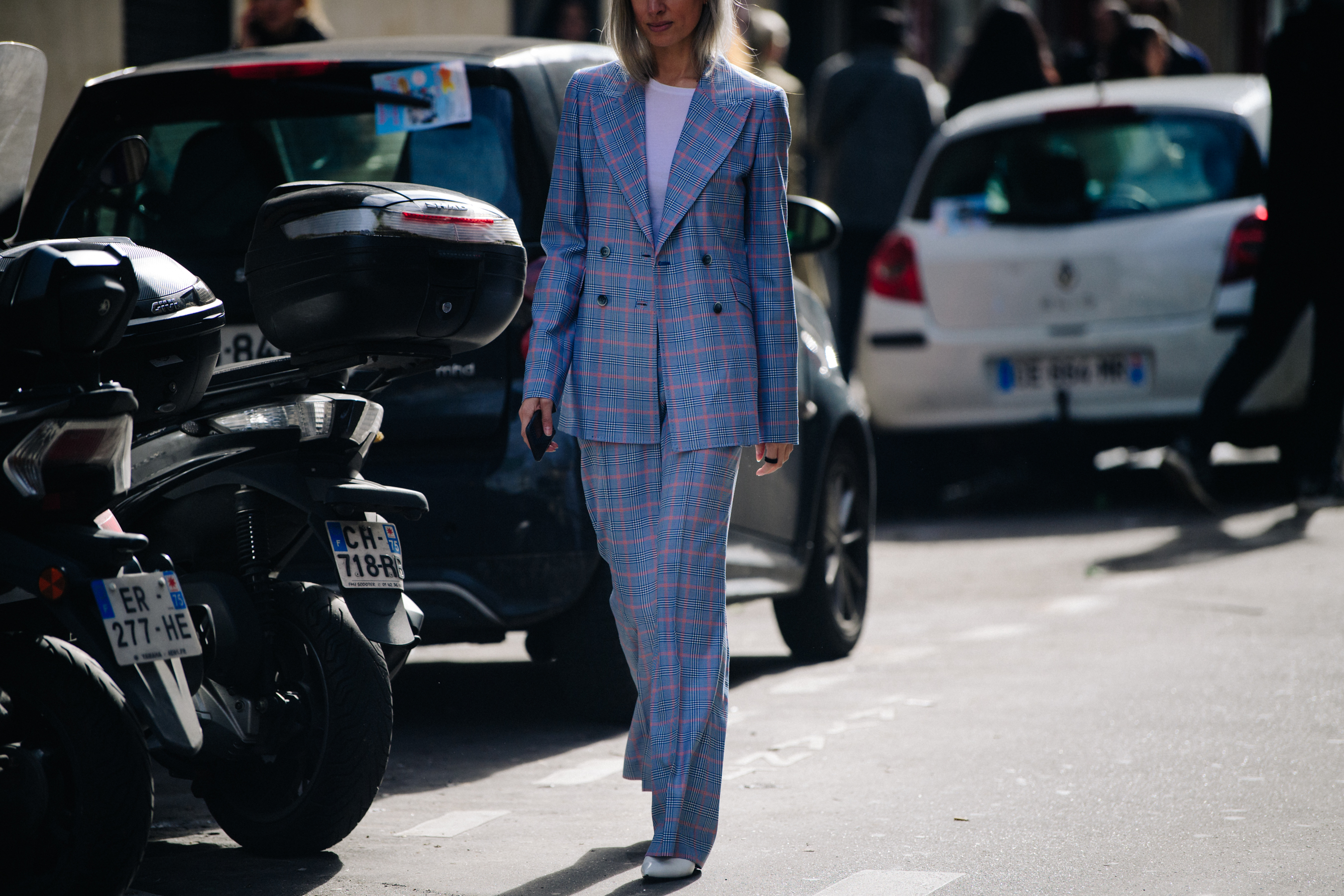 British woman wearing blue check suit