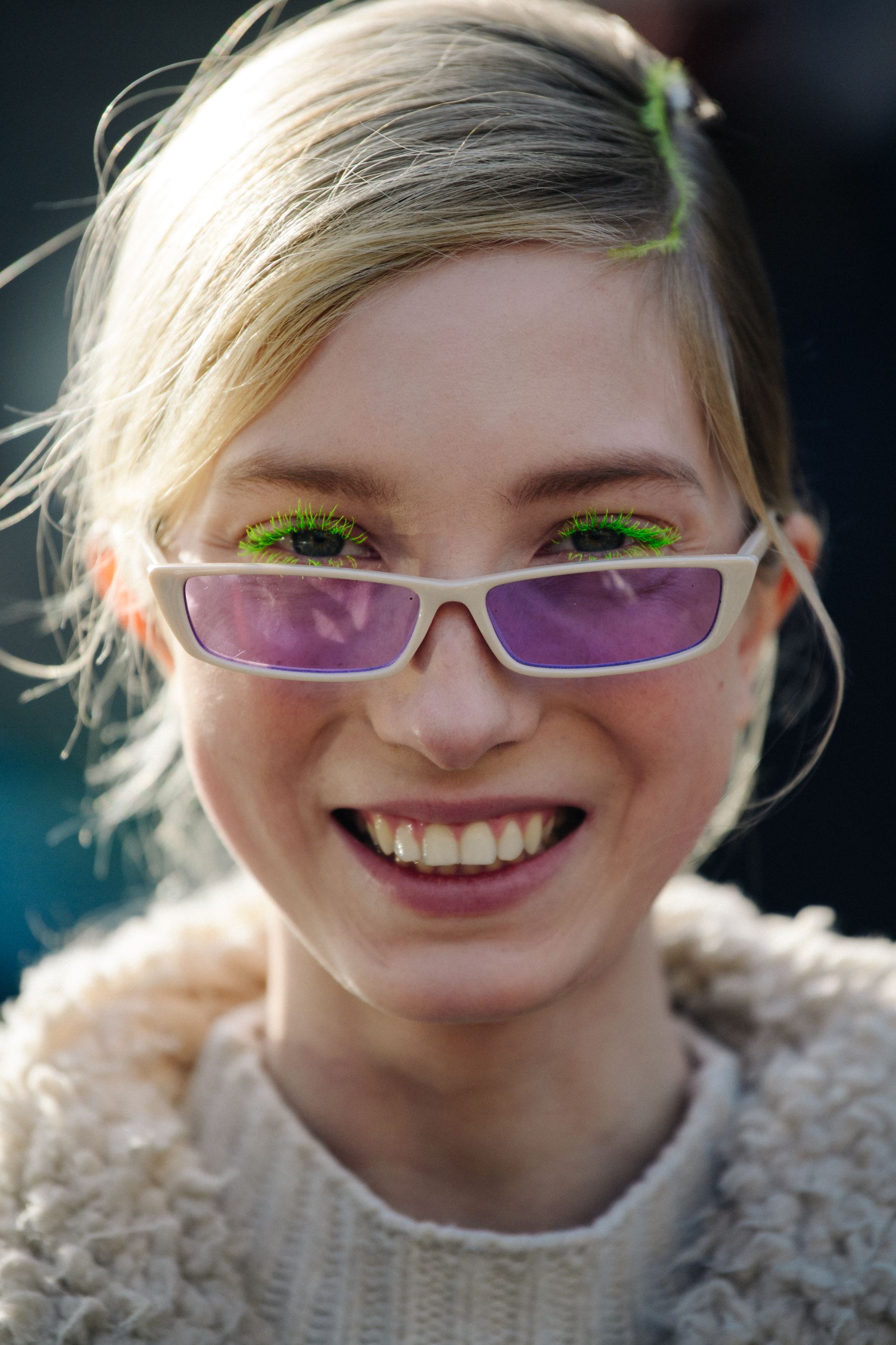 Portrait of model wearing purple lens glasses