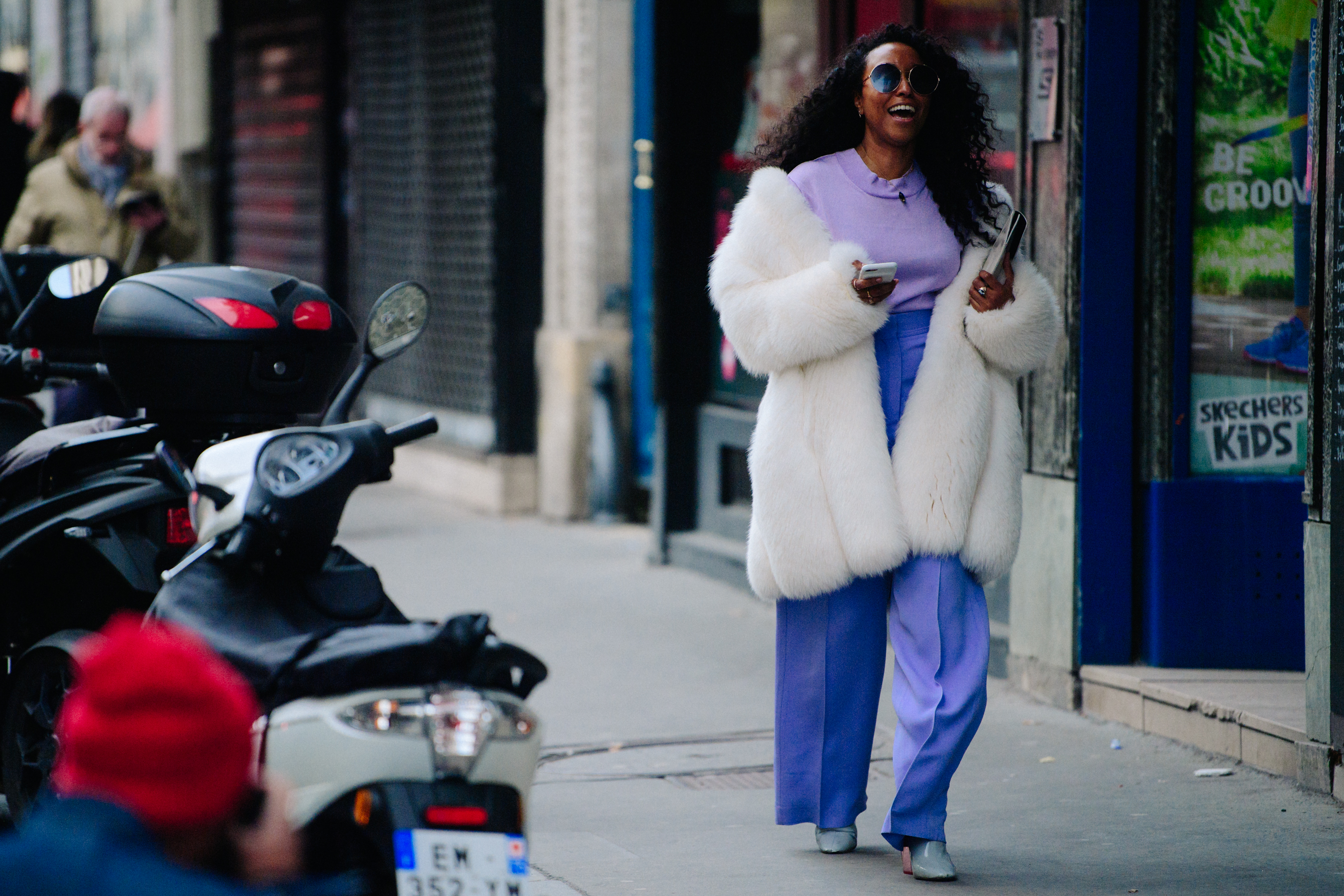 Woman wearing purple top and pants