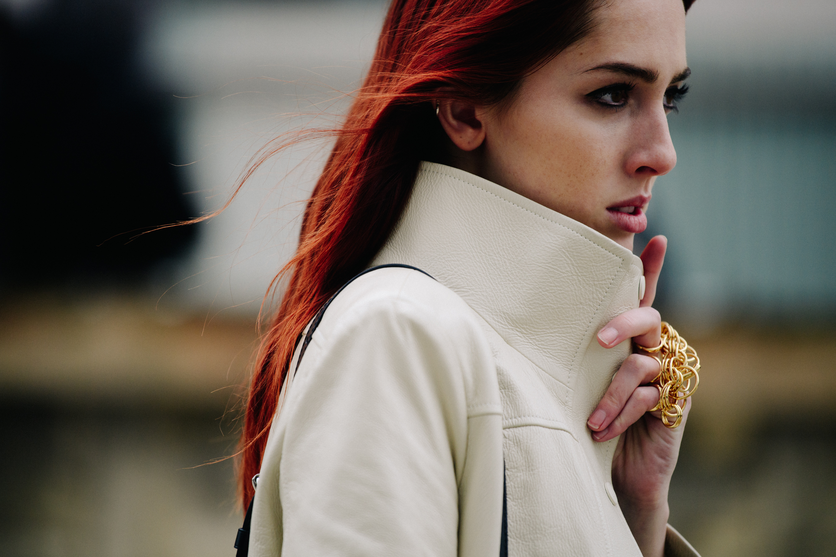 American model wearing white leather jacket