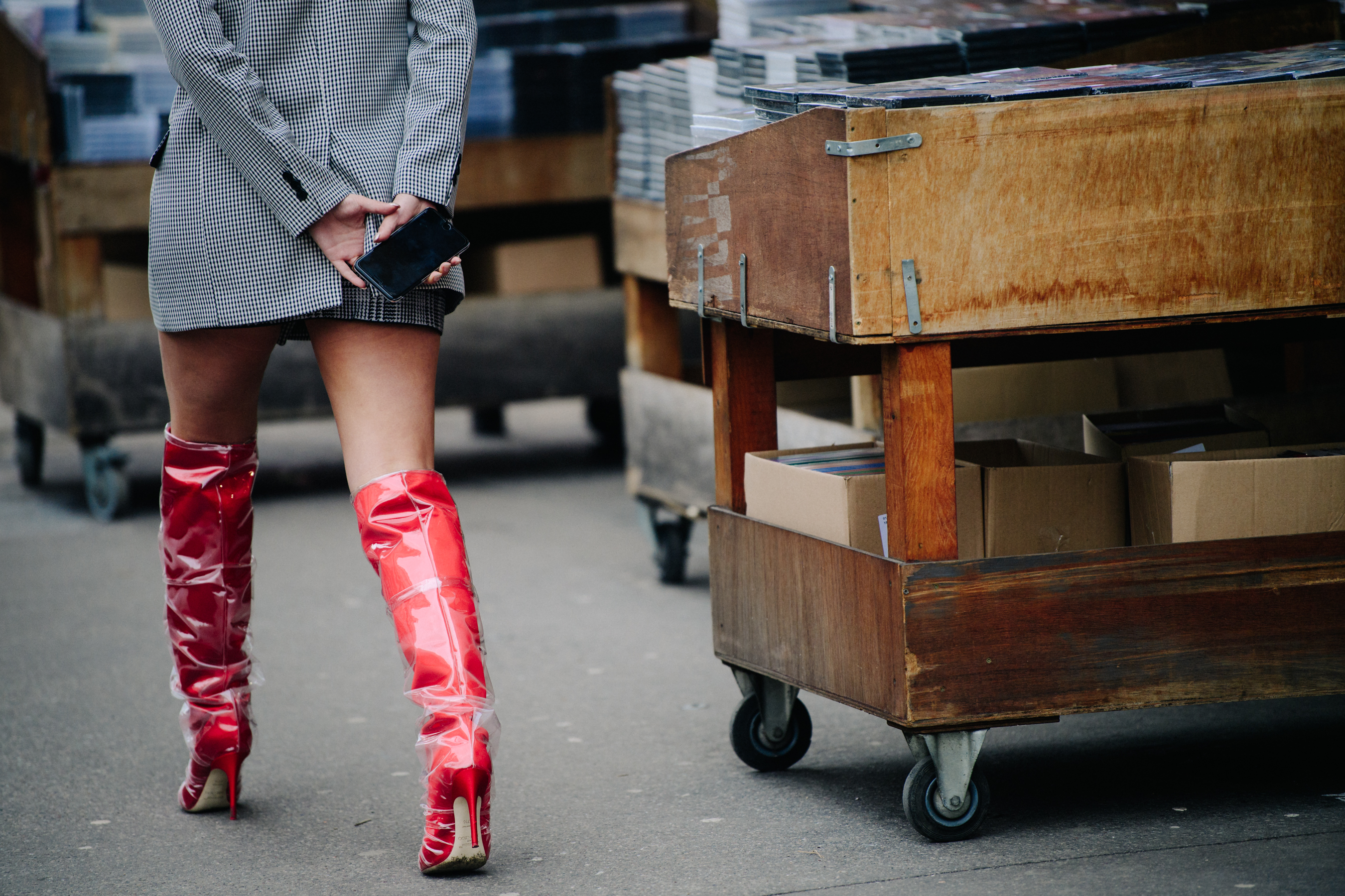 Woman wearing red plastic boots