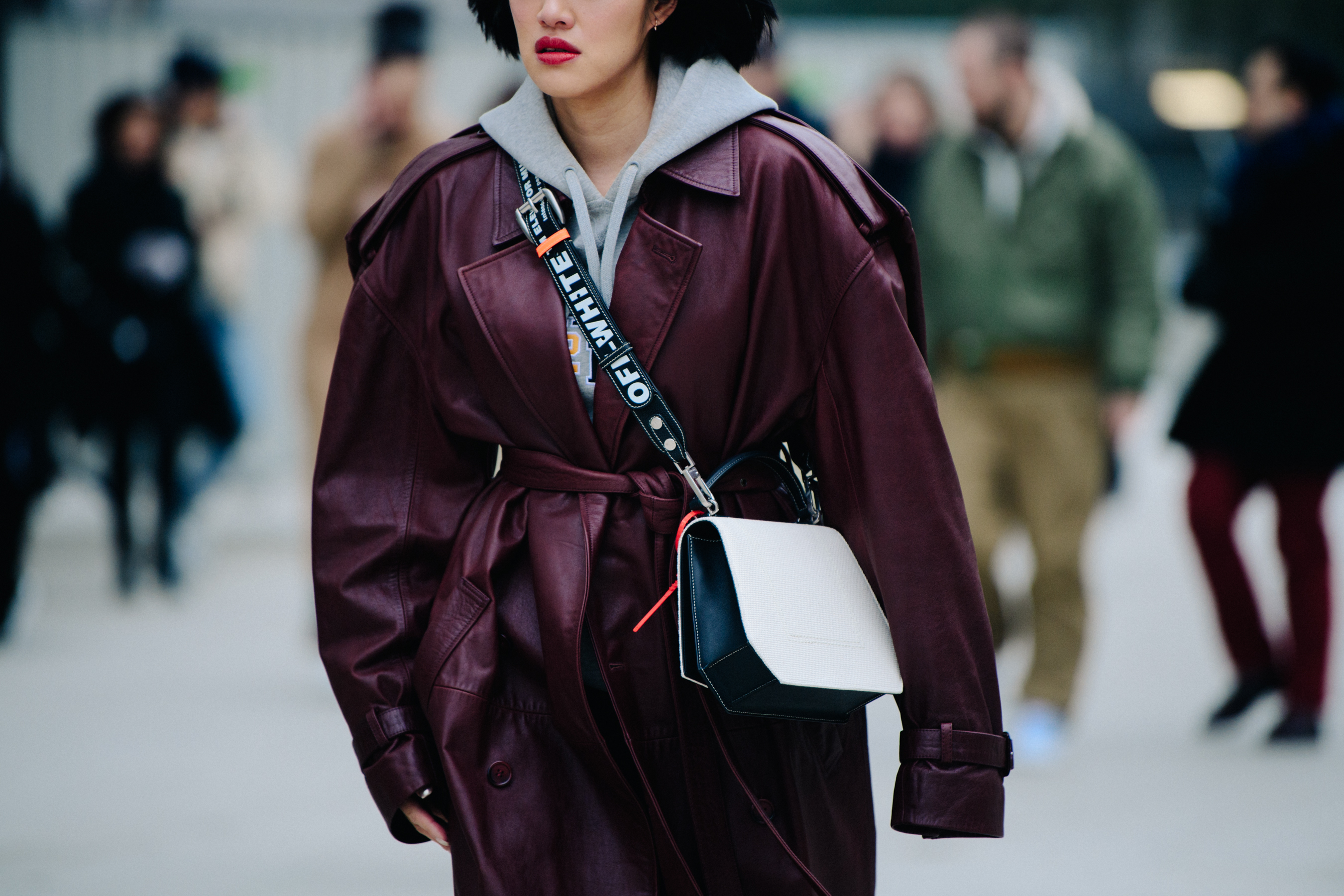 Asian blogger wearing red leather coat