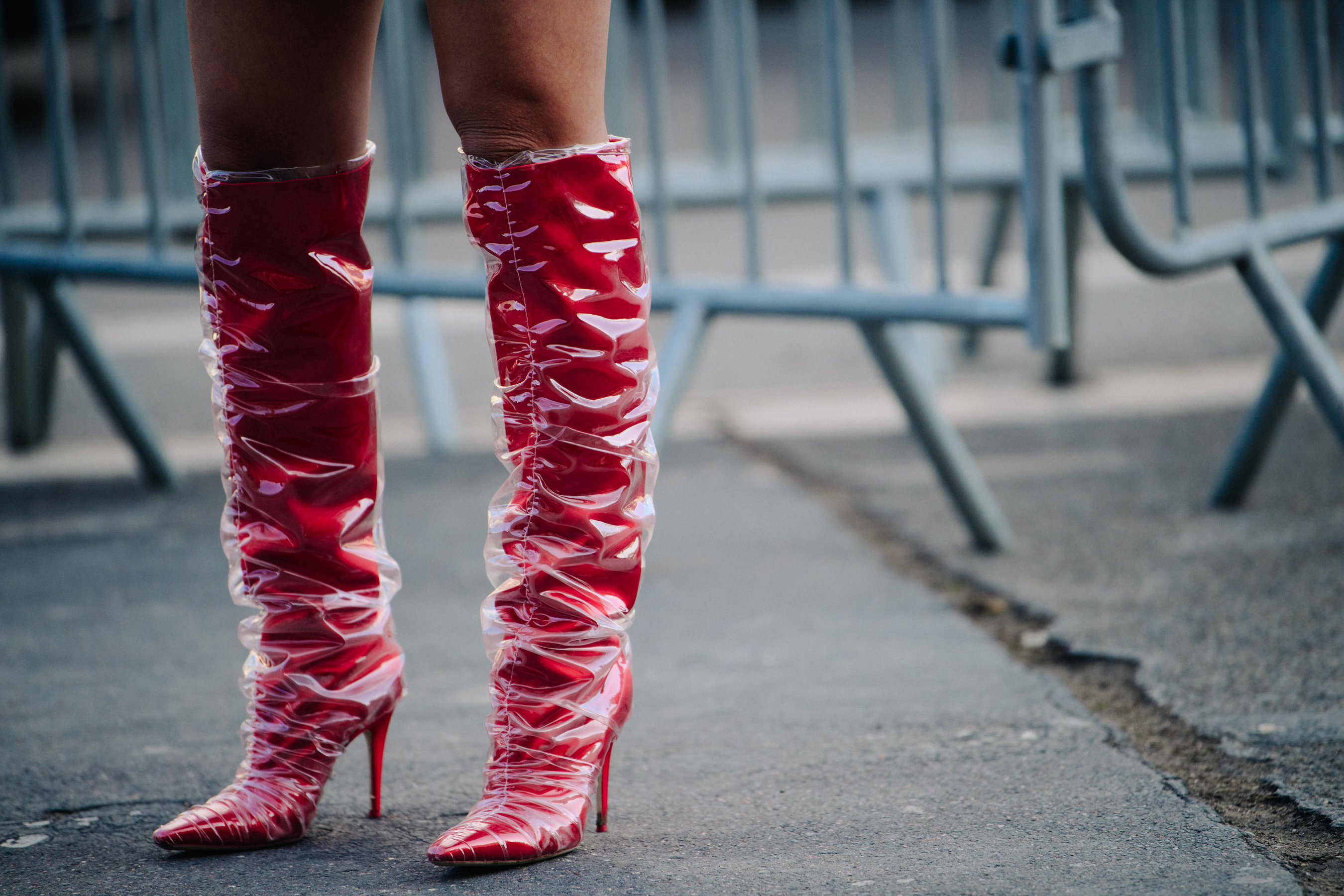Woman wearing red and plastic boots
