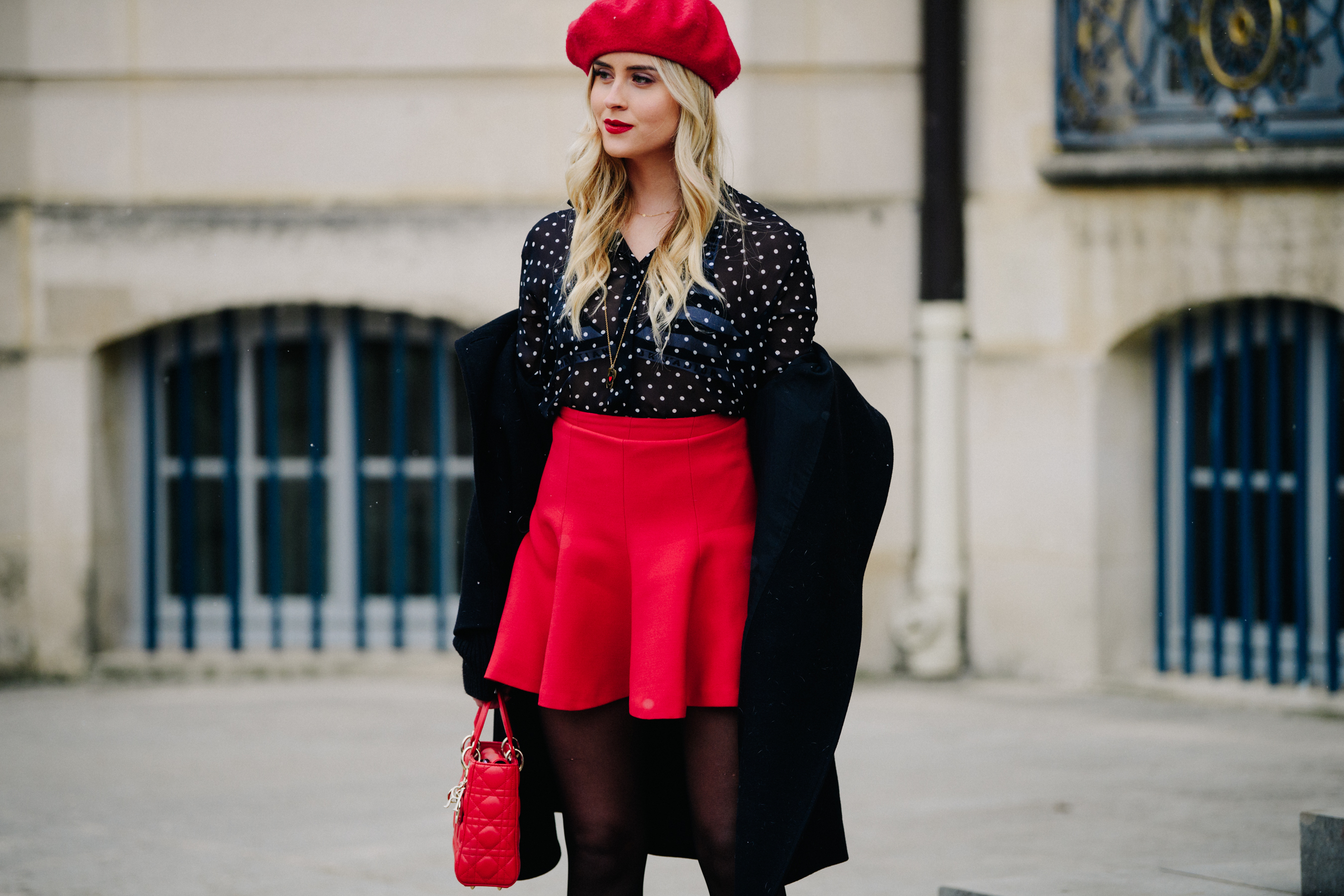 Woman wearing red skirt and beret