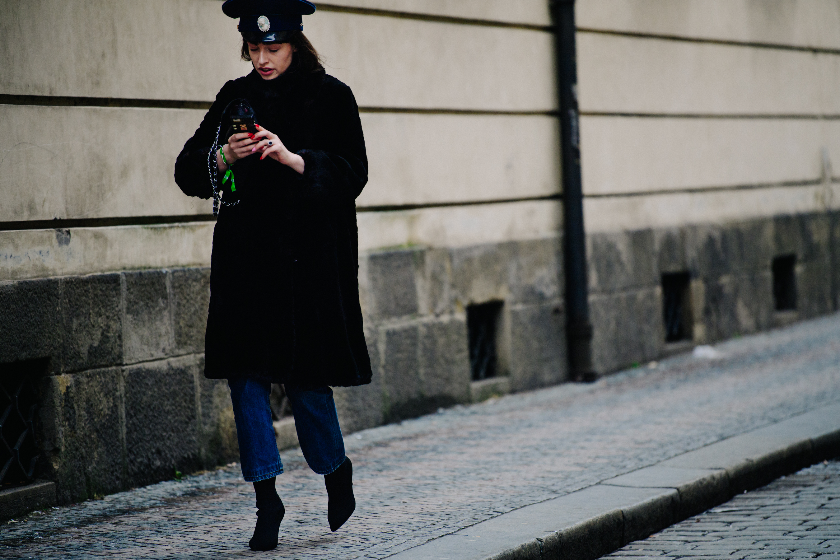 Woman wearing black military hat