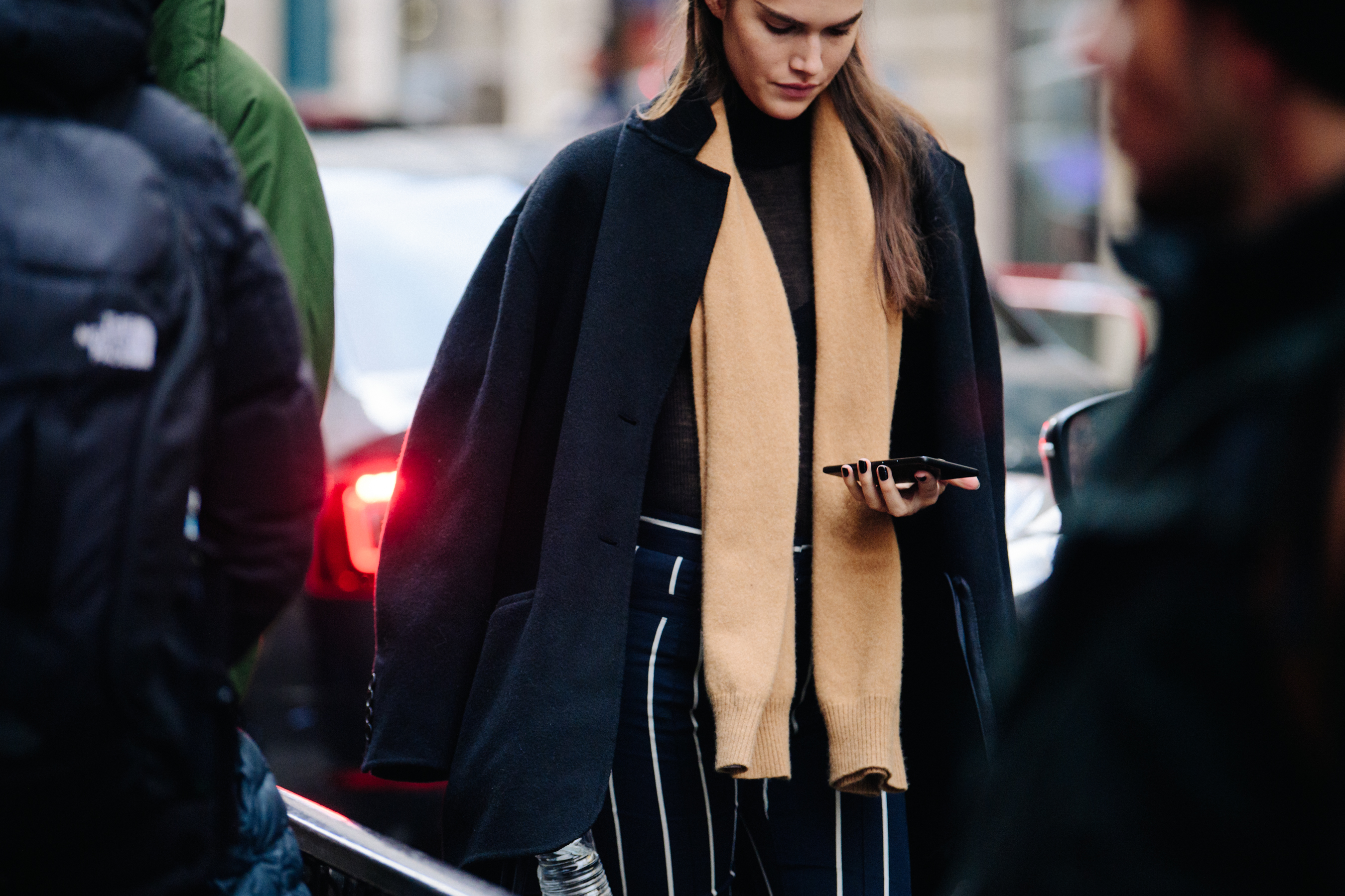 American model wearing brown scarf