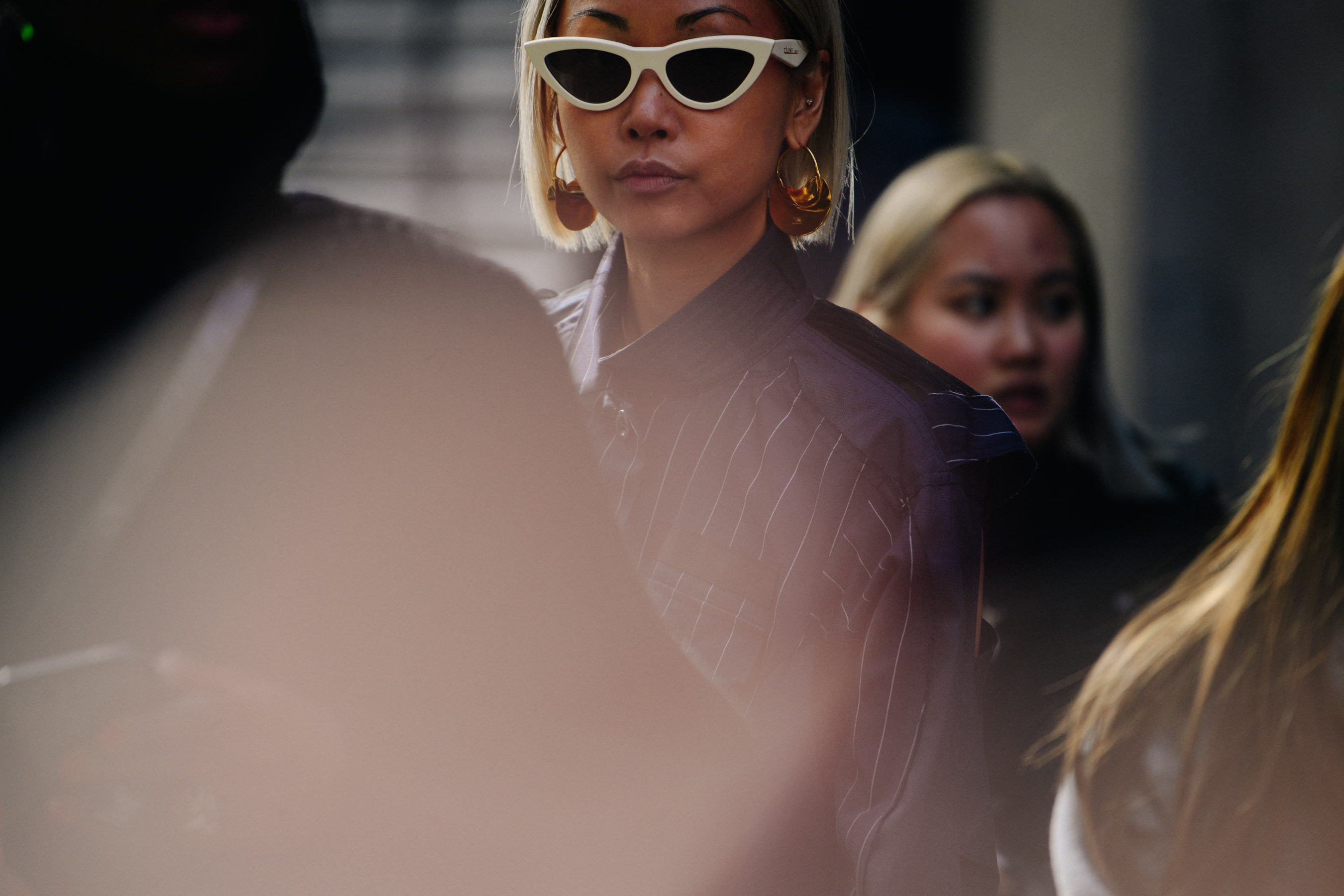 Asian blogger wearing white sunglasses