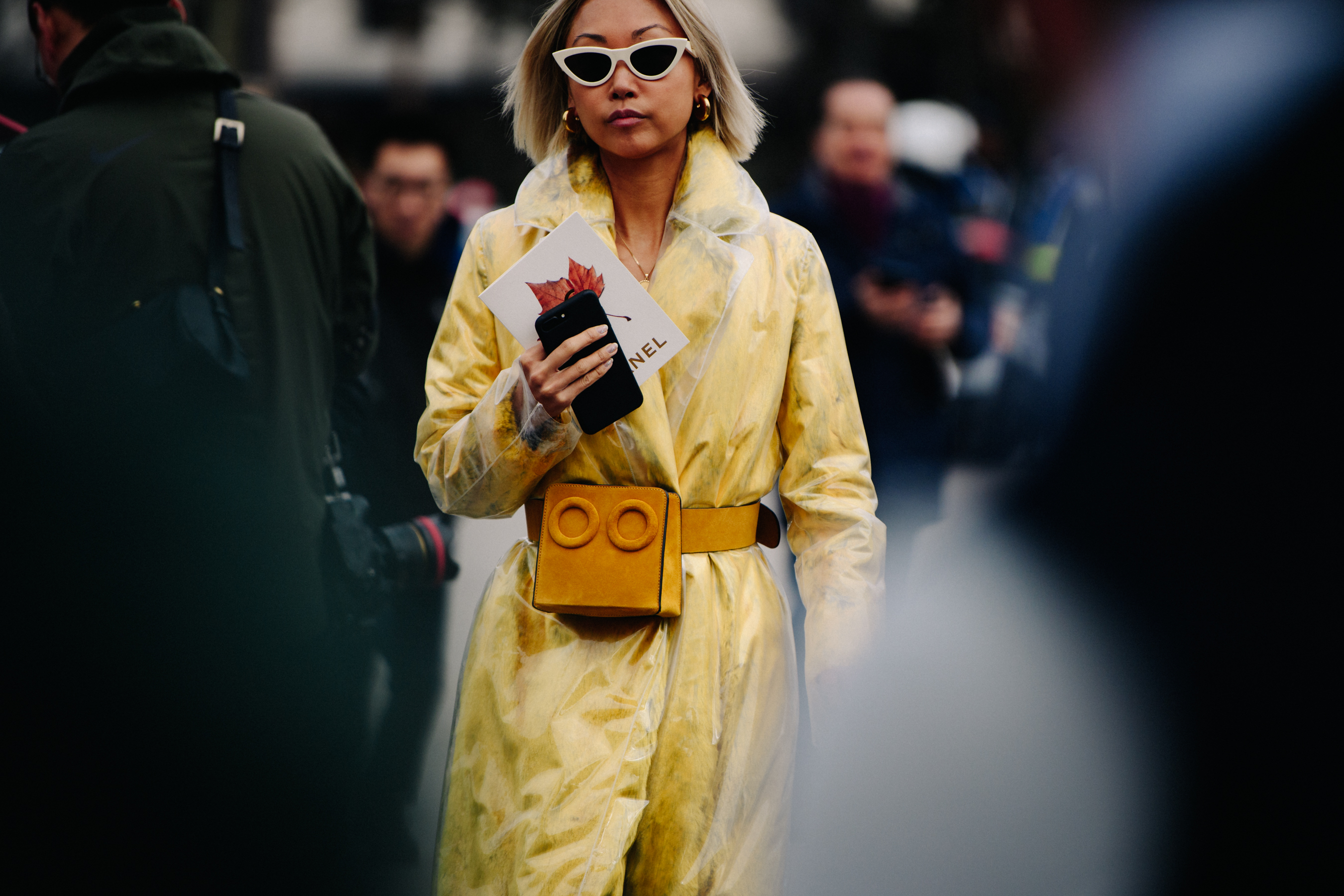 Asian blogger wearing yellow coat