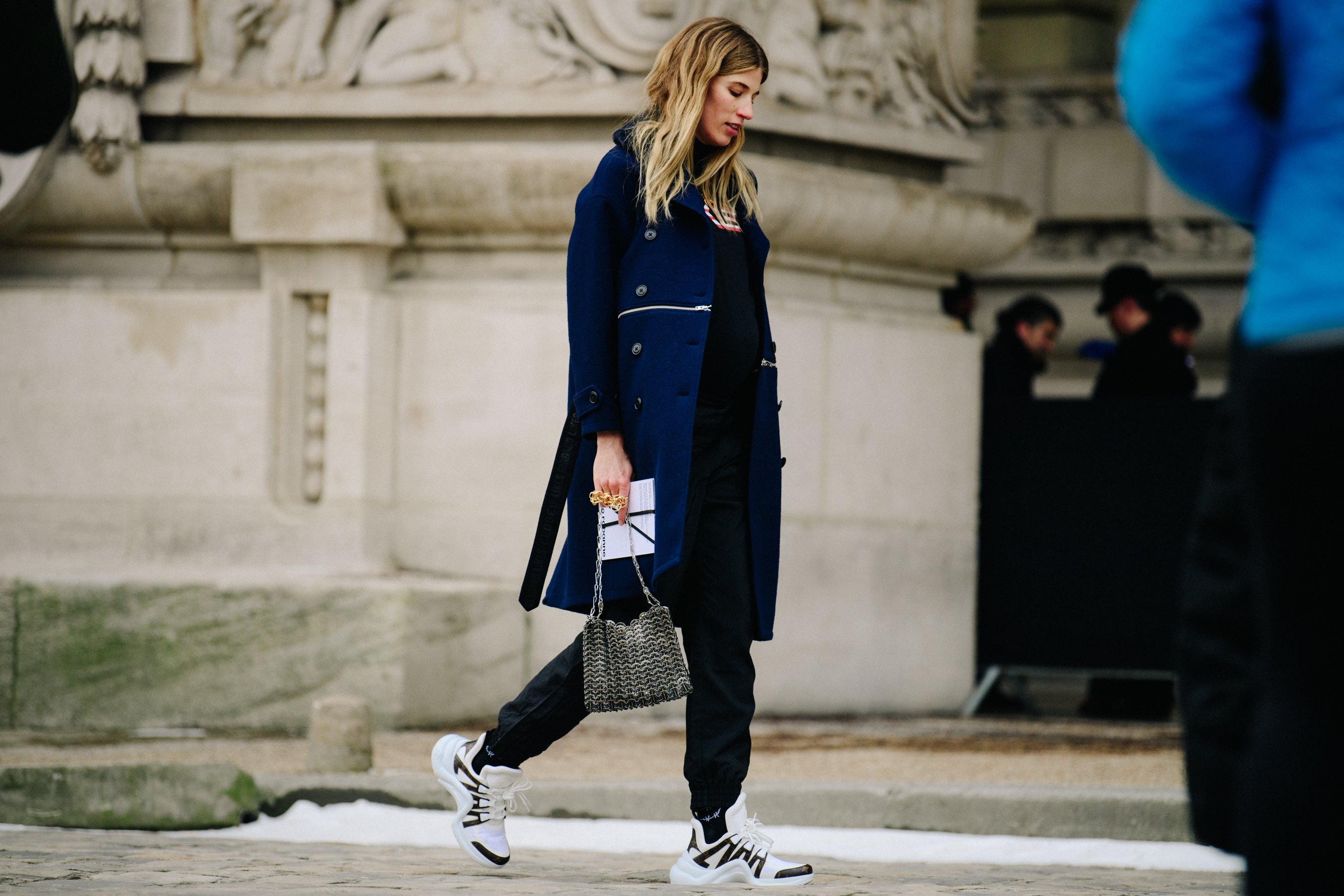 German woman wearing blue wool coat