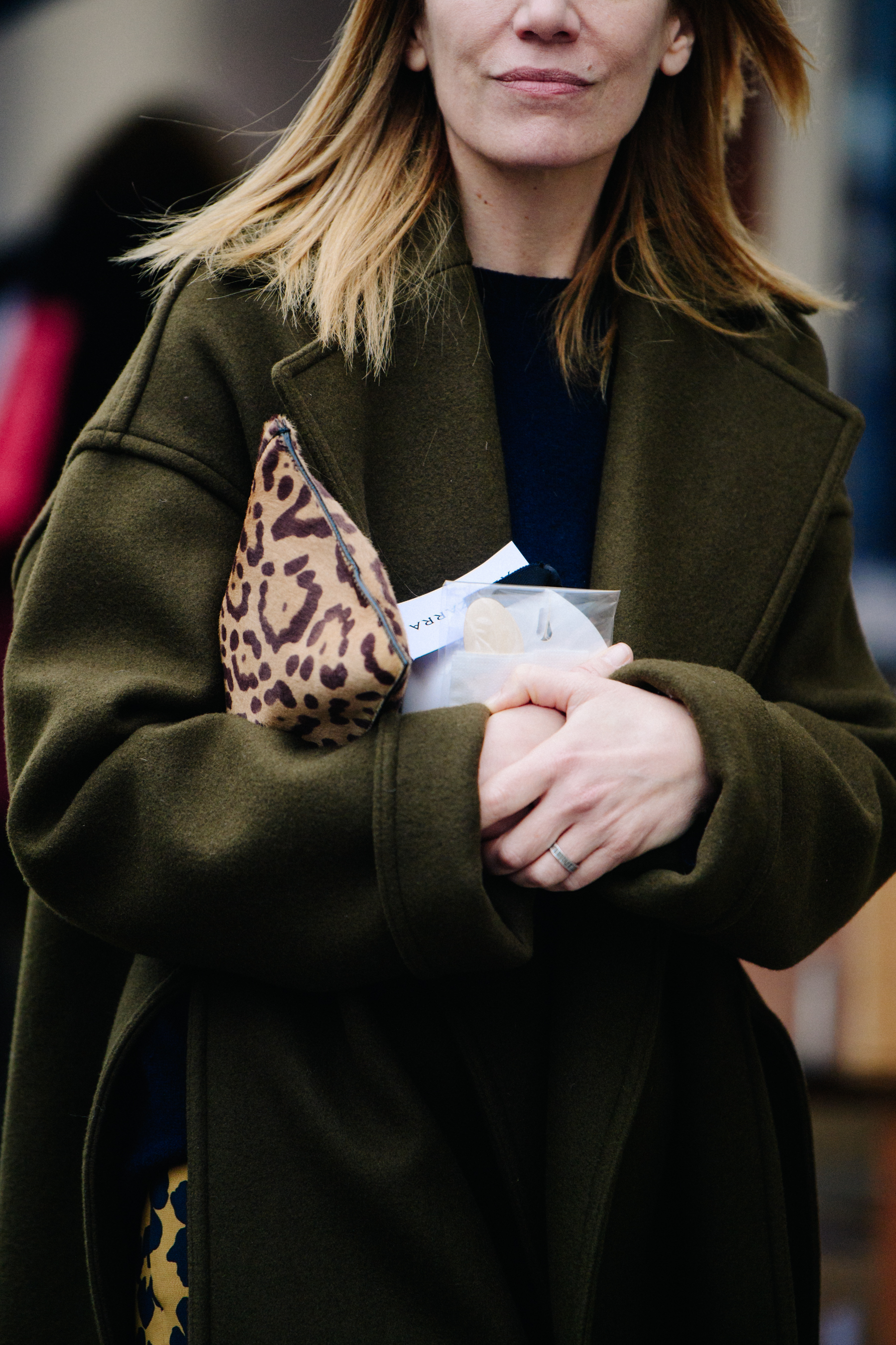 Woman wearing green wool coat