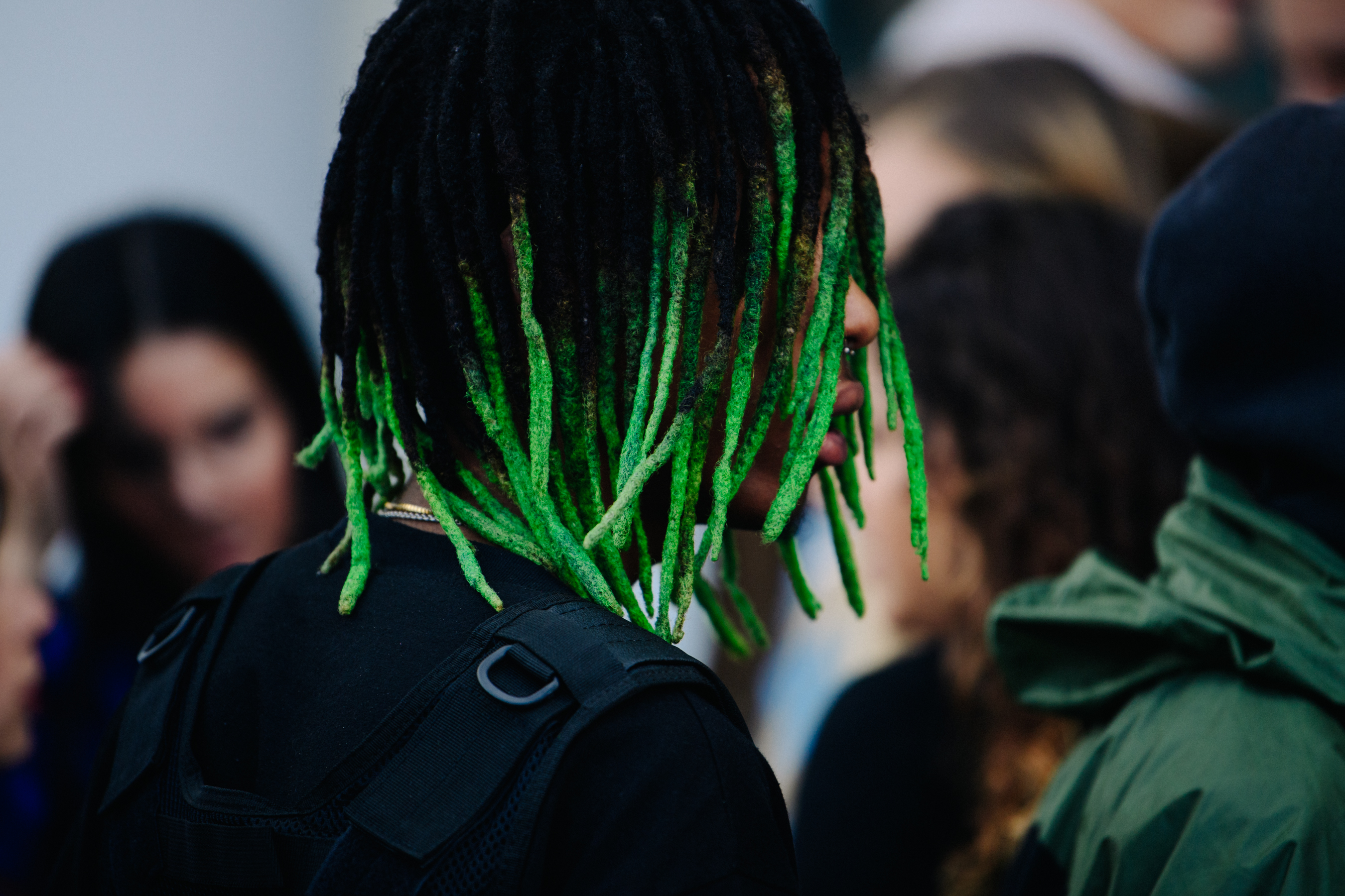 Man with green dreadlocks