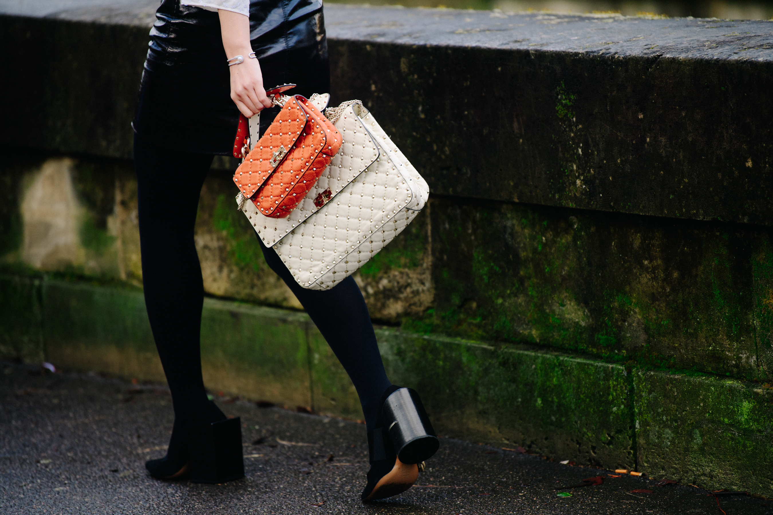 Woman carrying two handbags