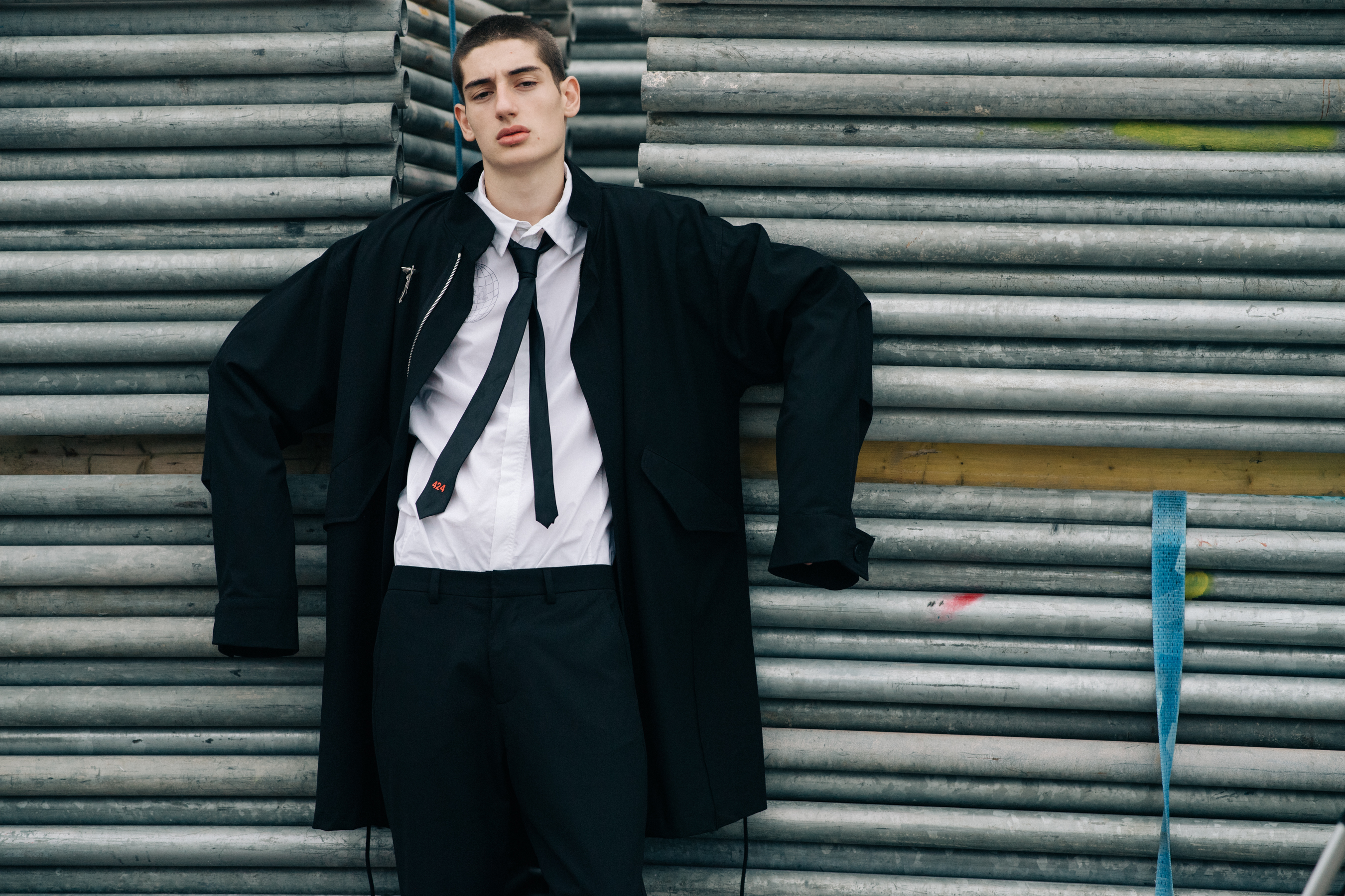 Male model wearing white shirt and a suit