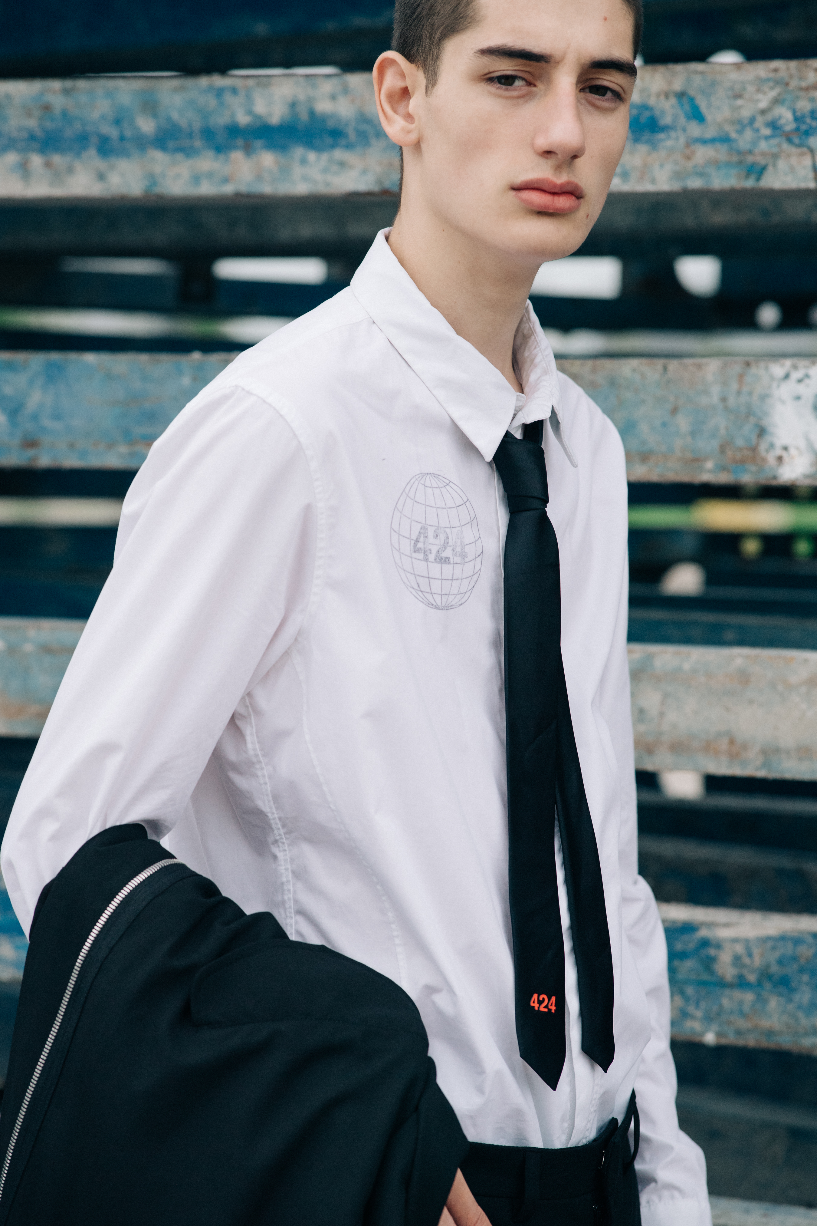 Male model wearing white shirt and a suit
