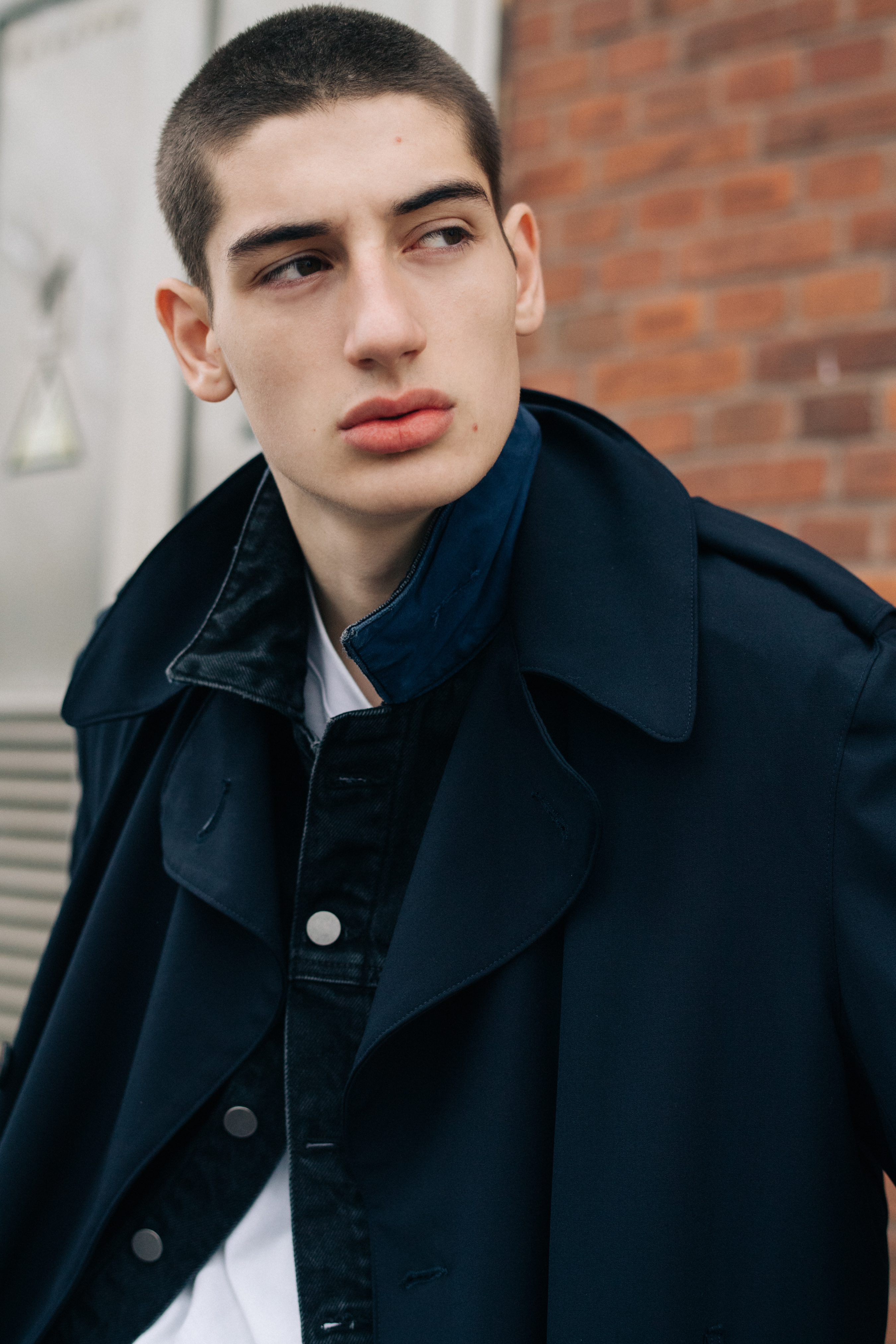 Male model wearing white shirt and a suit