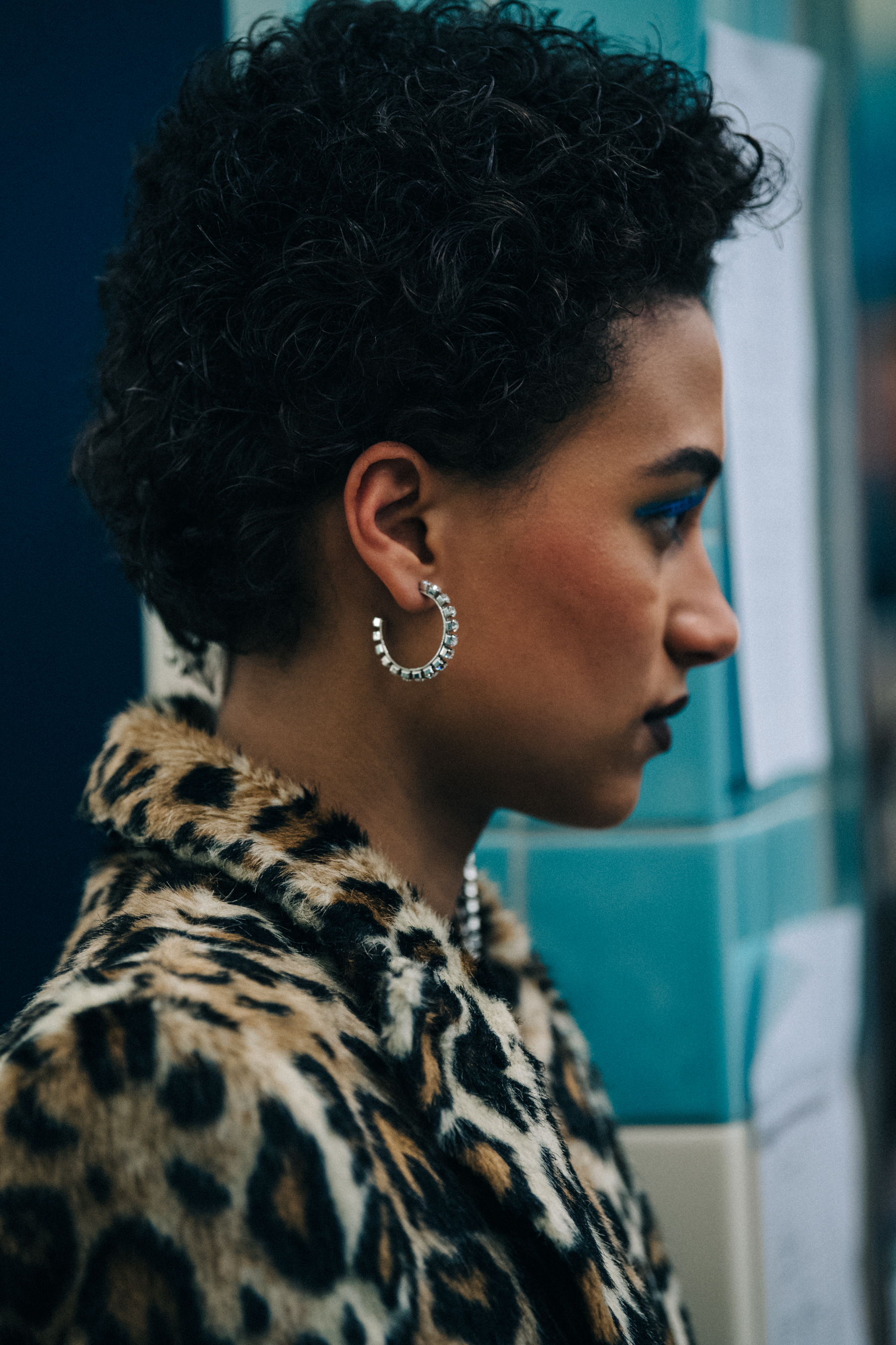 Model wearing animal print outfit backstage