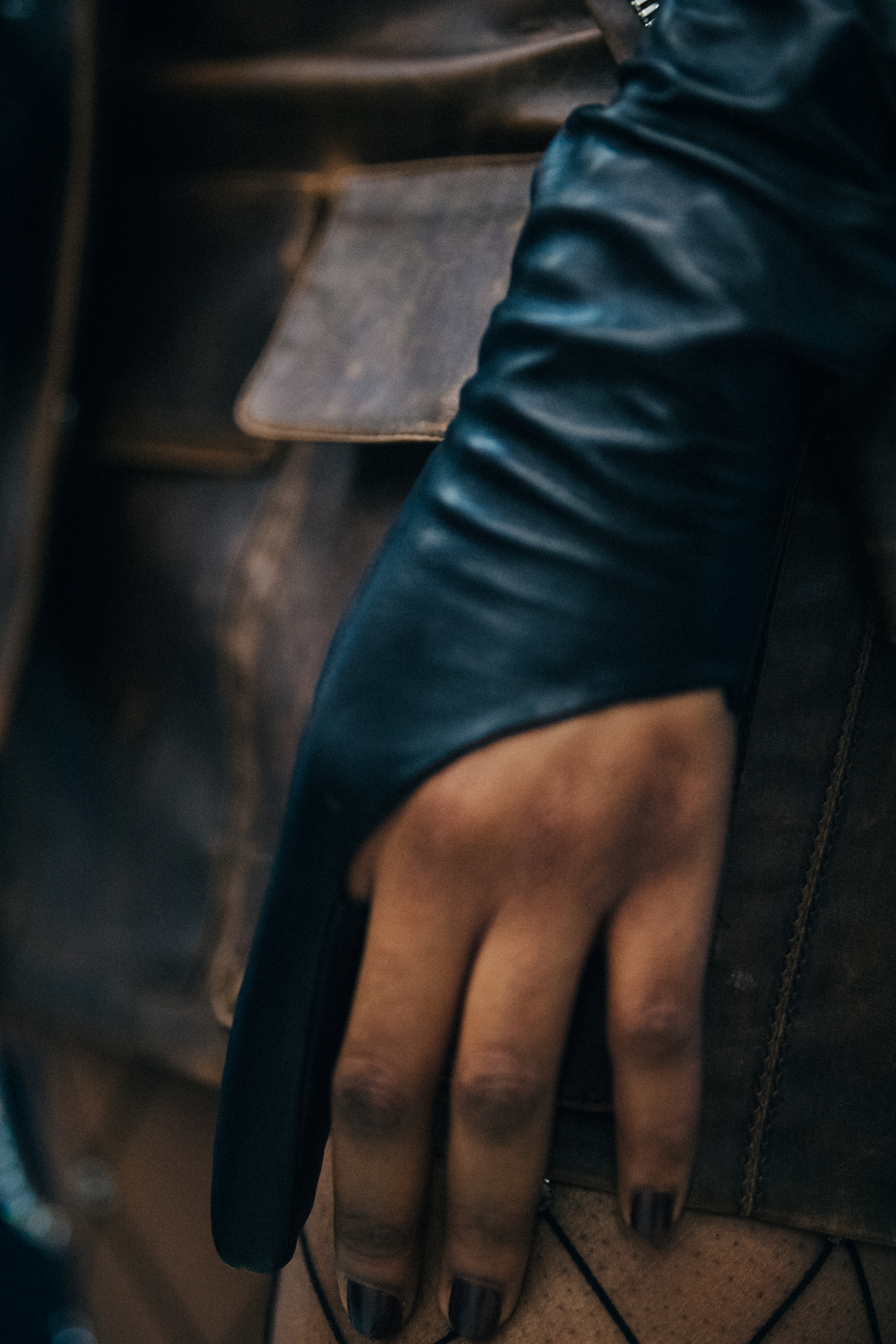 Model wearing black leather glove