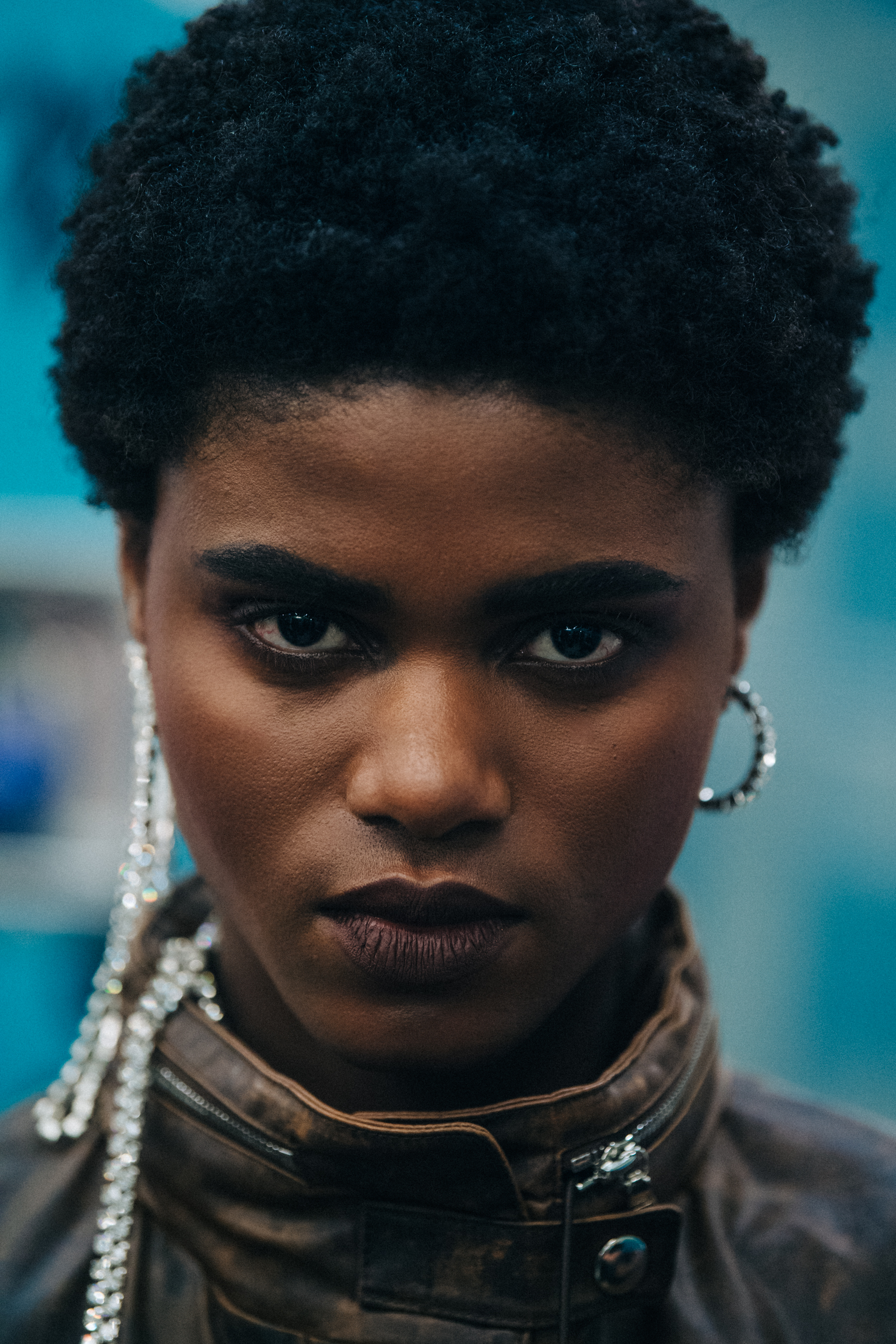Portrait of model backstage wearing silver earrings