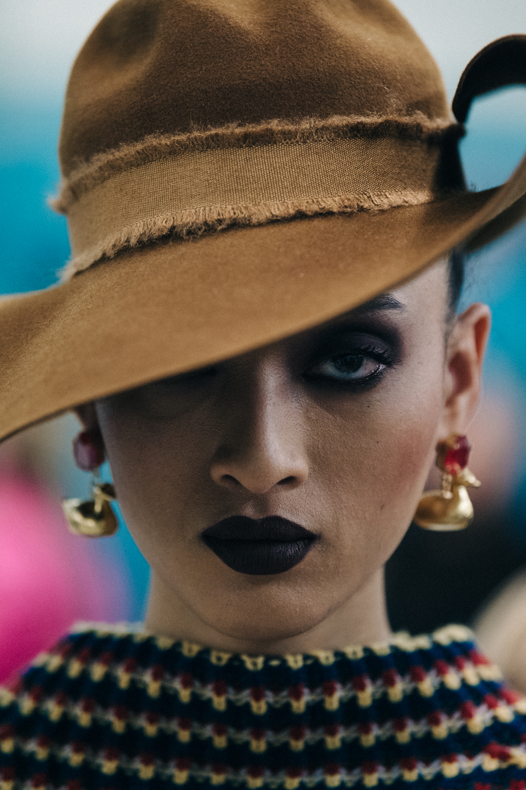 Portrait of model wearing brown wide brimmed hat
