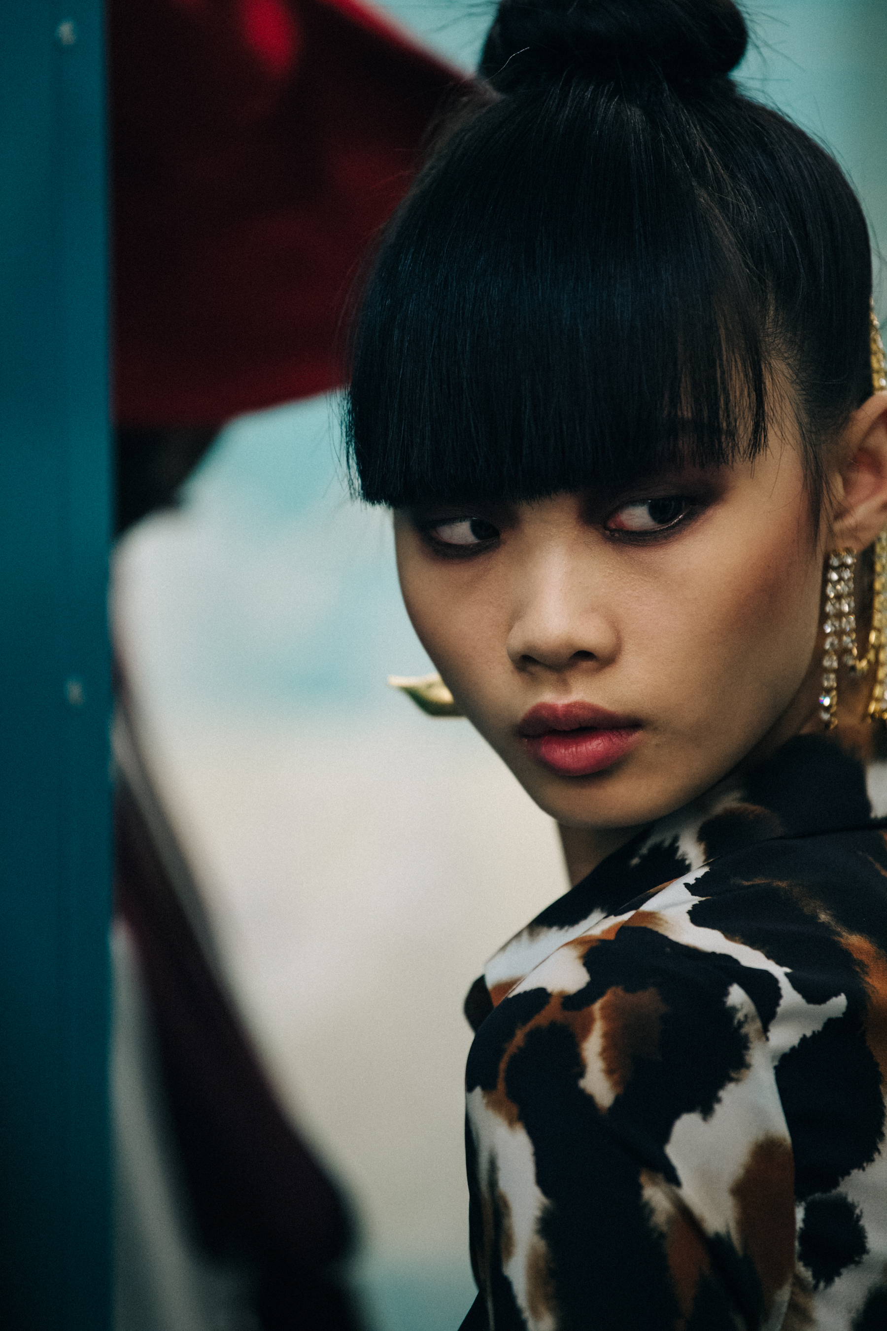 Model wearing animal print outfit backstage