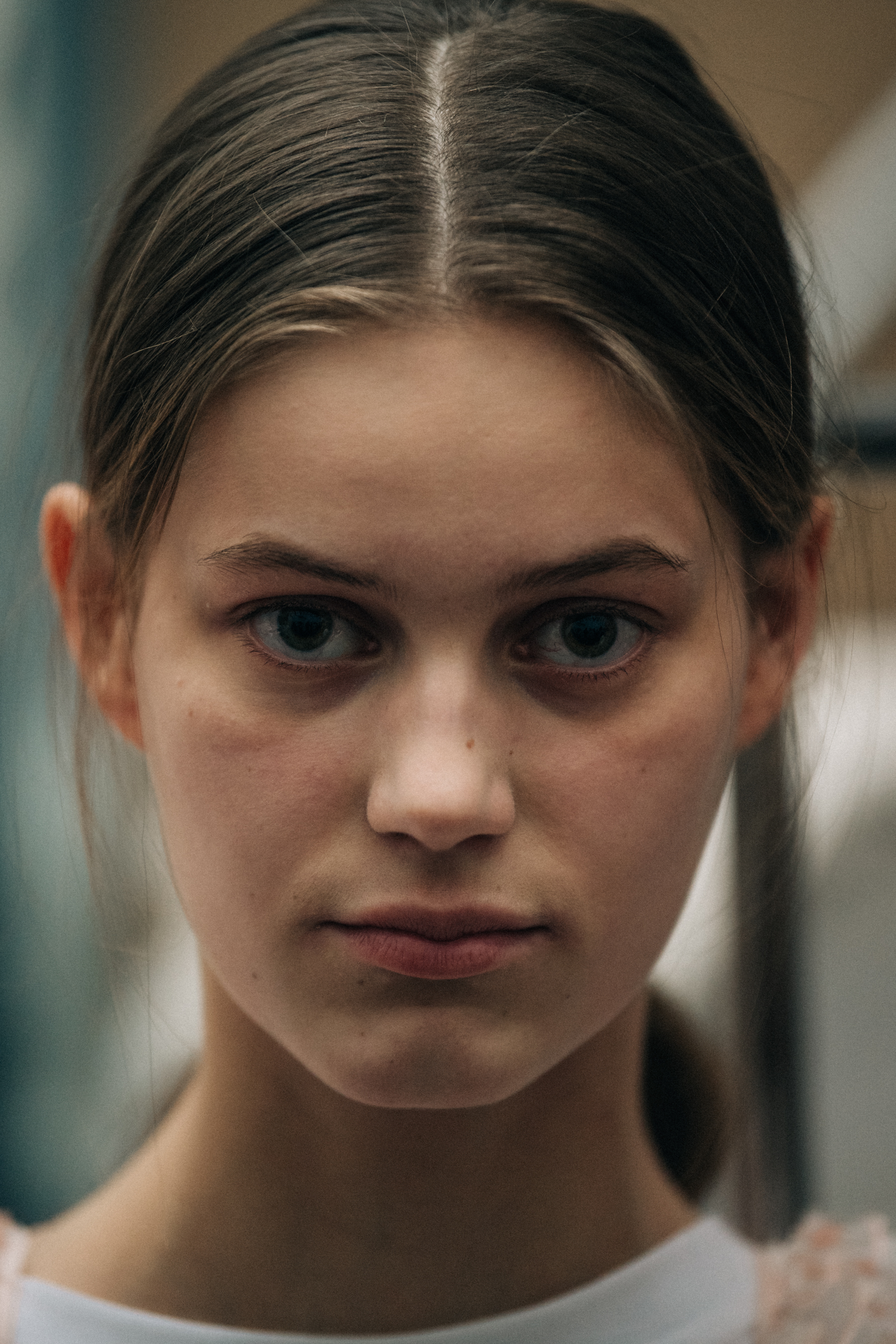 Portrait of model with green eyes at Cecilie Bahnsen