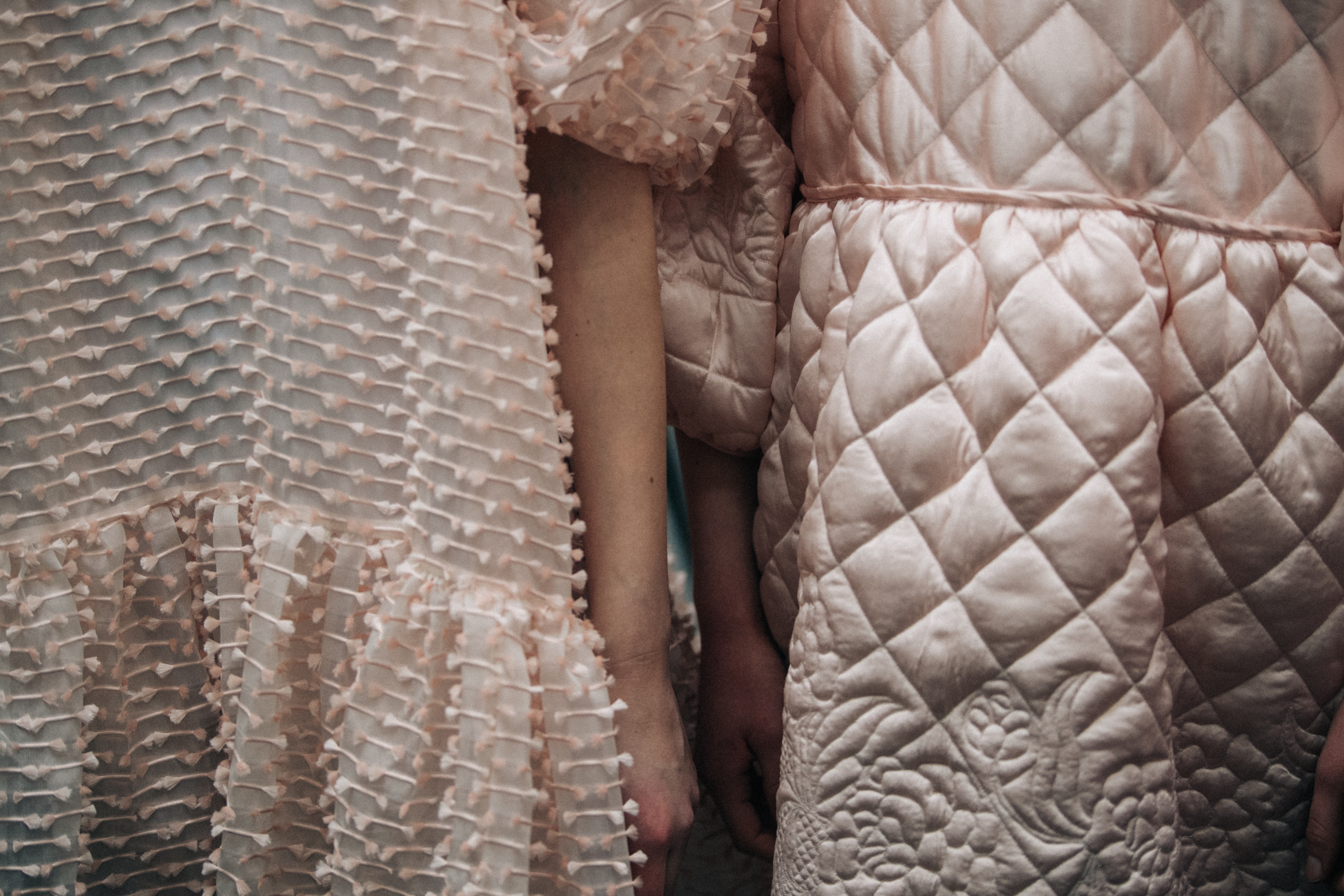 Model wearing quilted pink outfit at Cecilie Bahnsen