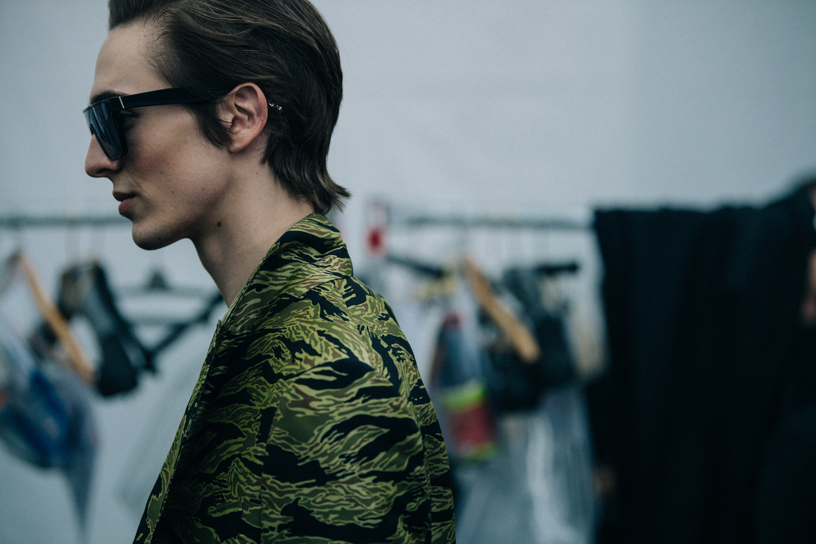 Model wearing camouflage Tom Ford jacket