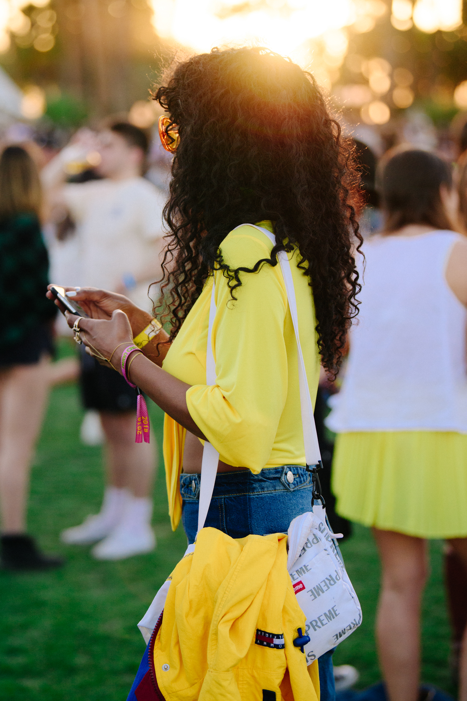 Woman wearing yellow shirt and jacket