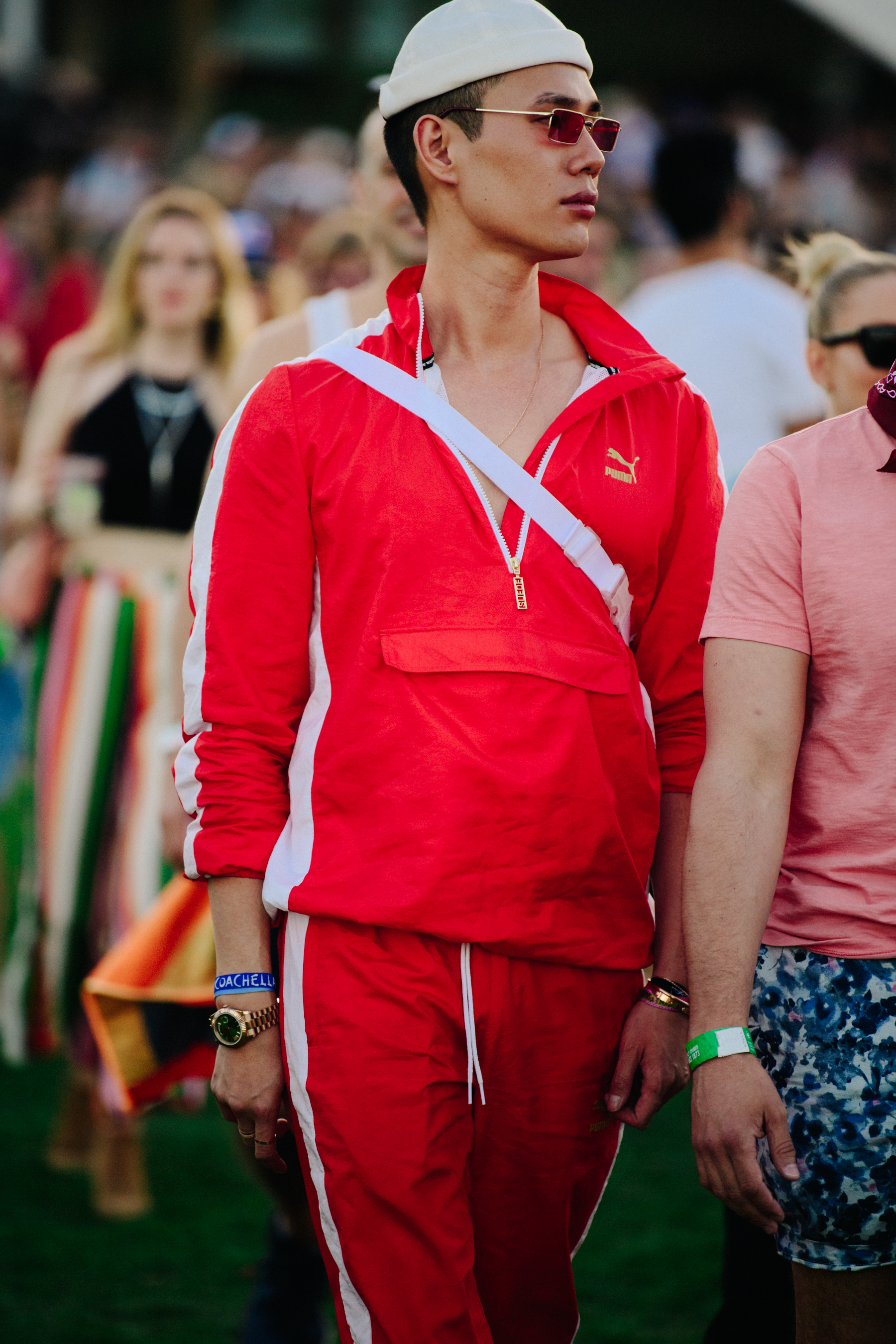 Asian man wearing red tracksuit