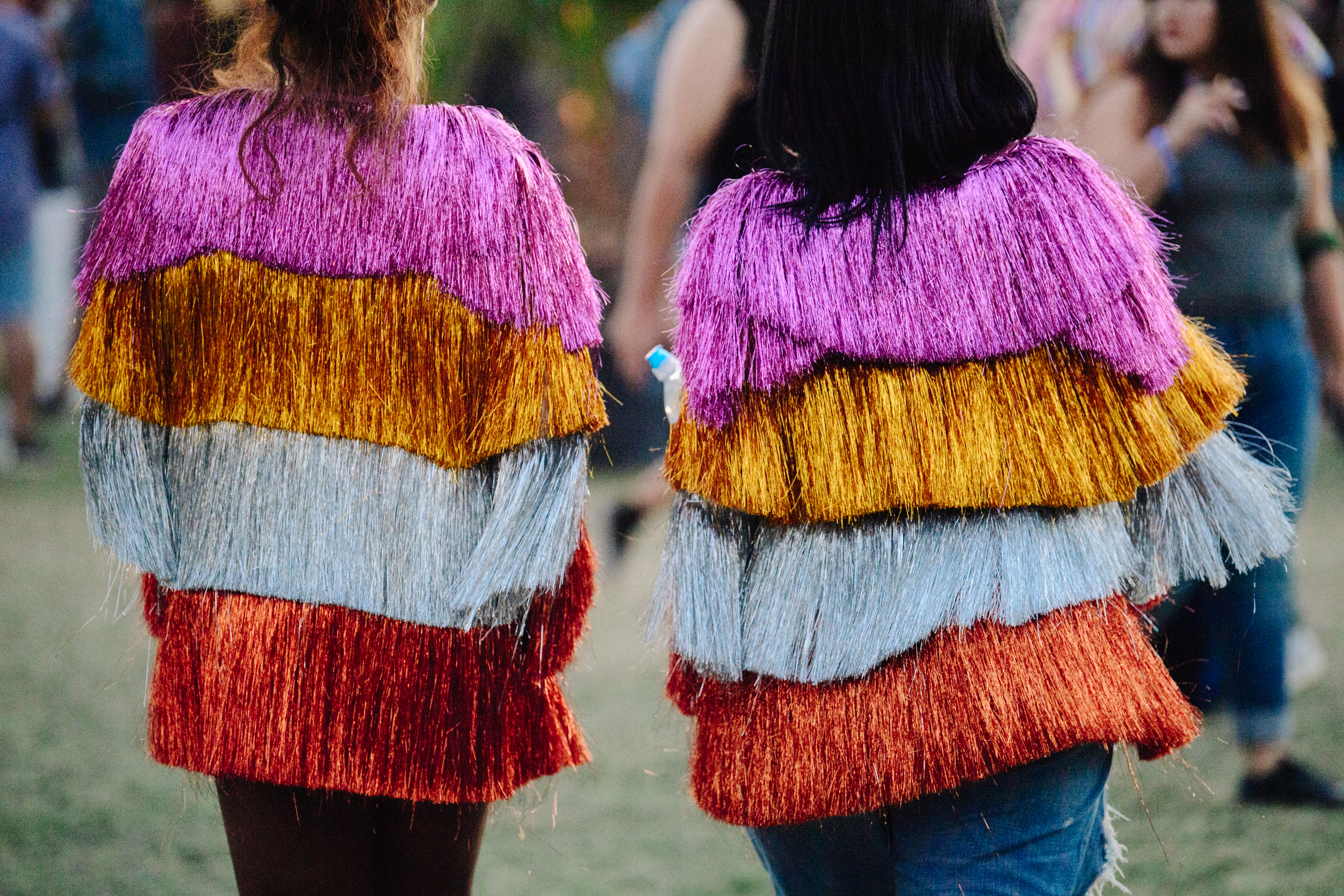 Two women wearing matching striped tops
