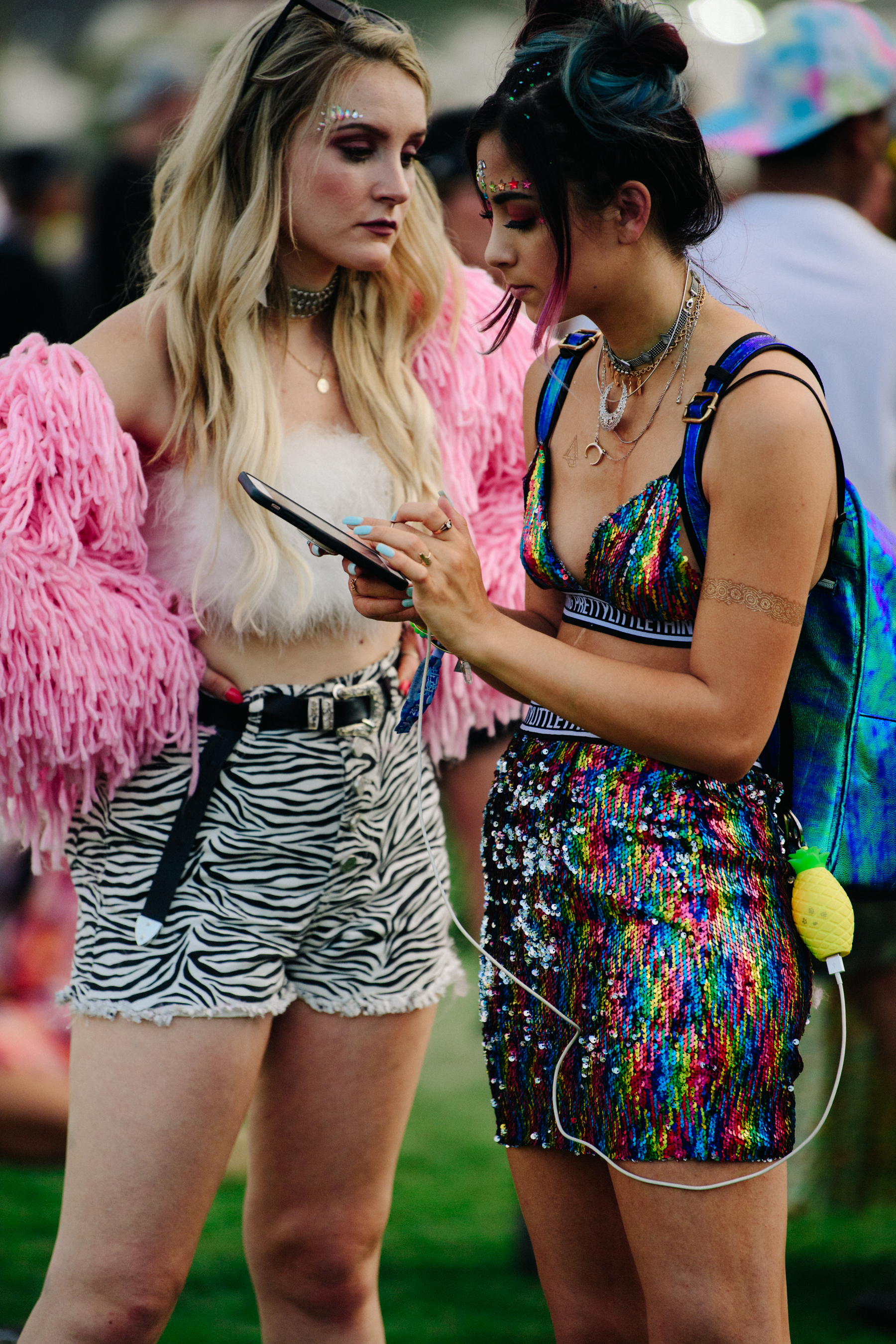 Two girls wearing colourful outfits