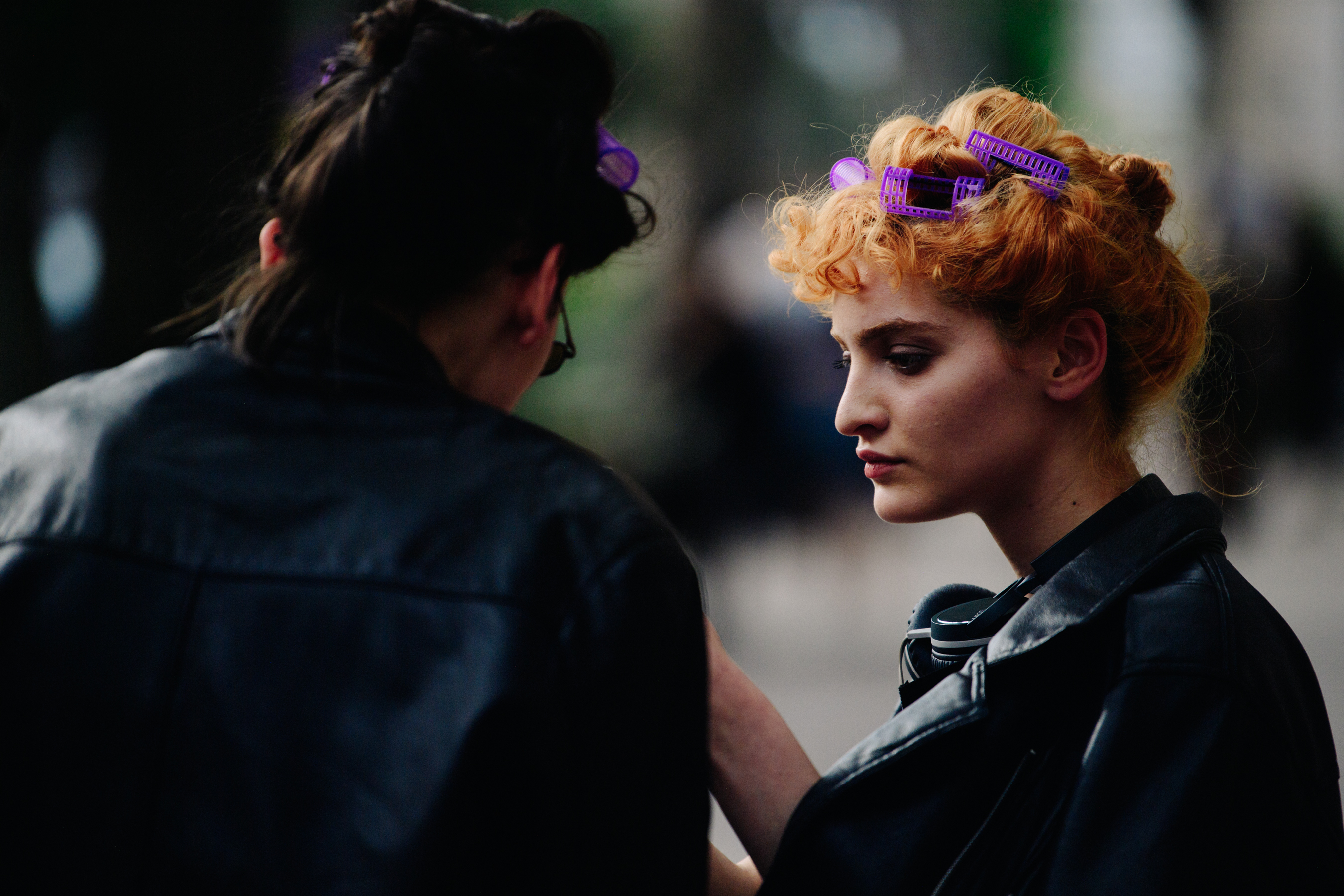 Two models with hair rollers in