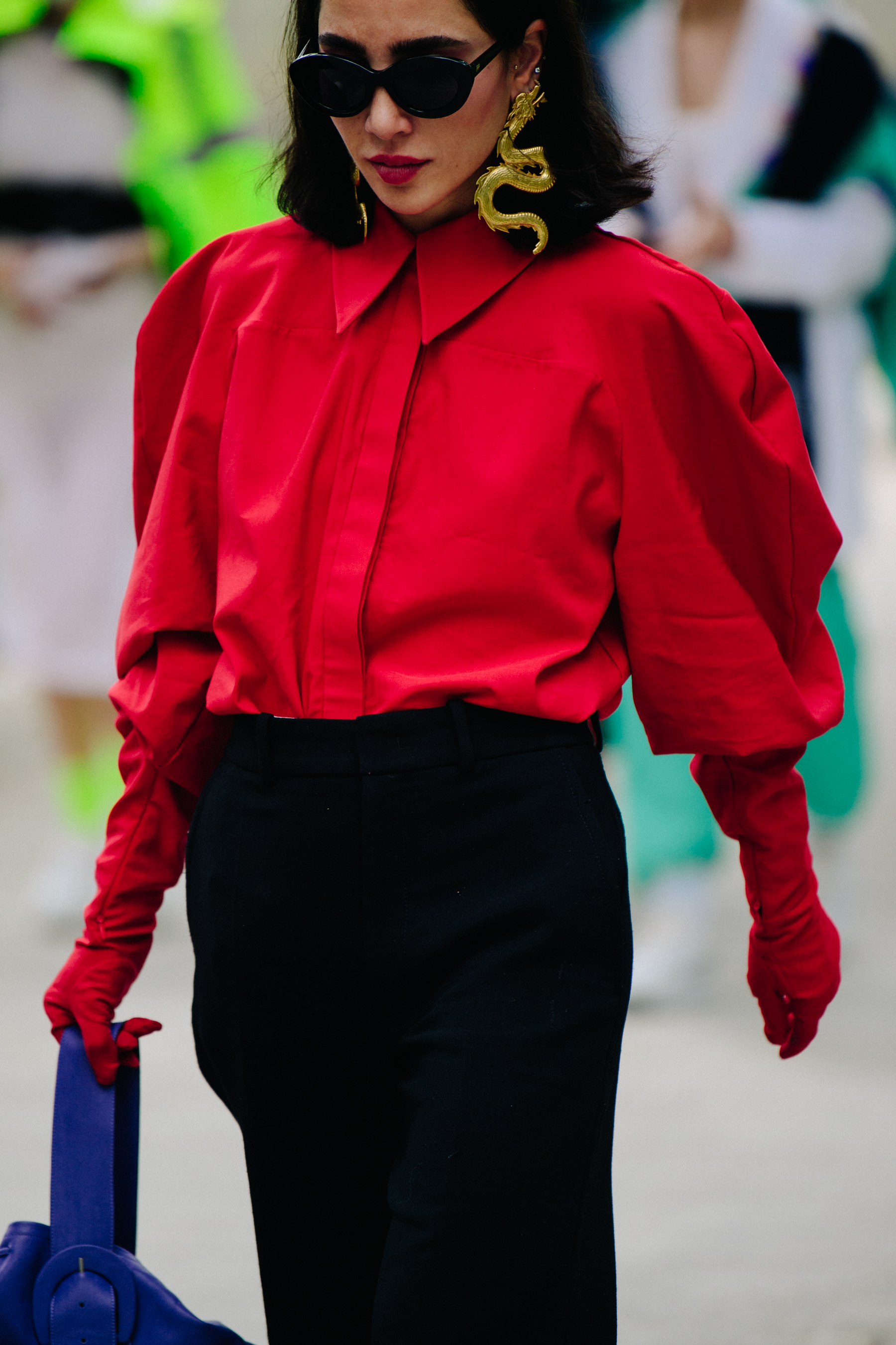 Woman wearing red shirt and gloves