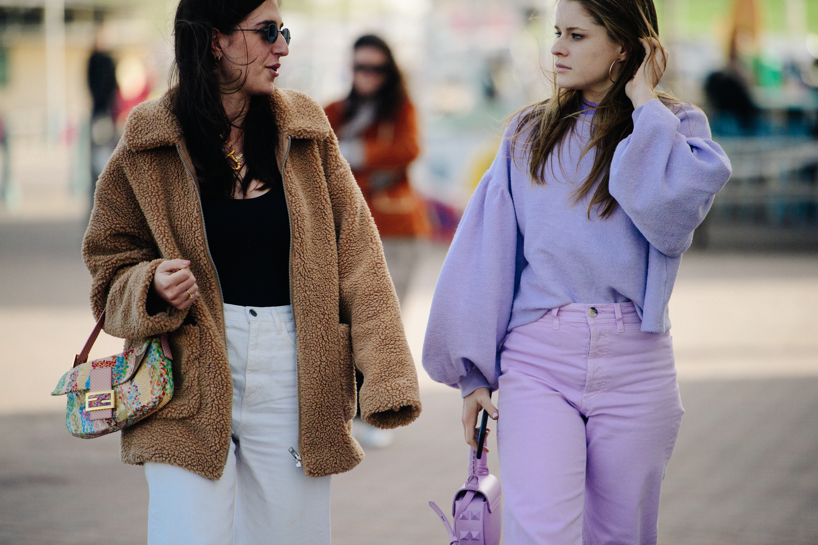 Two women wearing wool tops