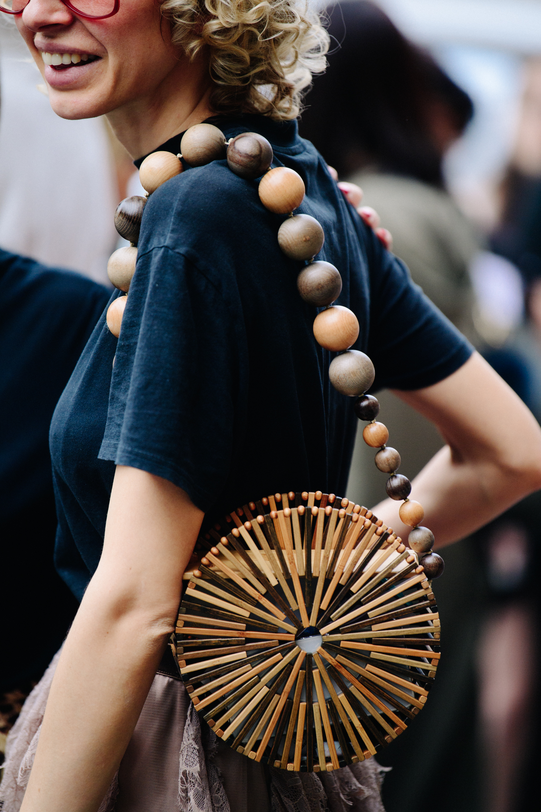 Woman carrying wooden bag