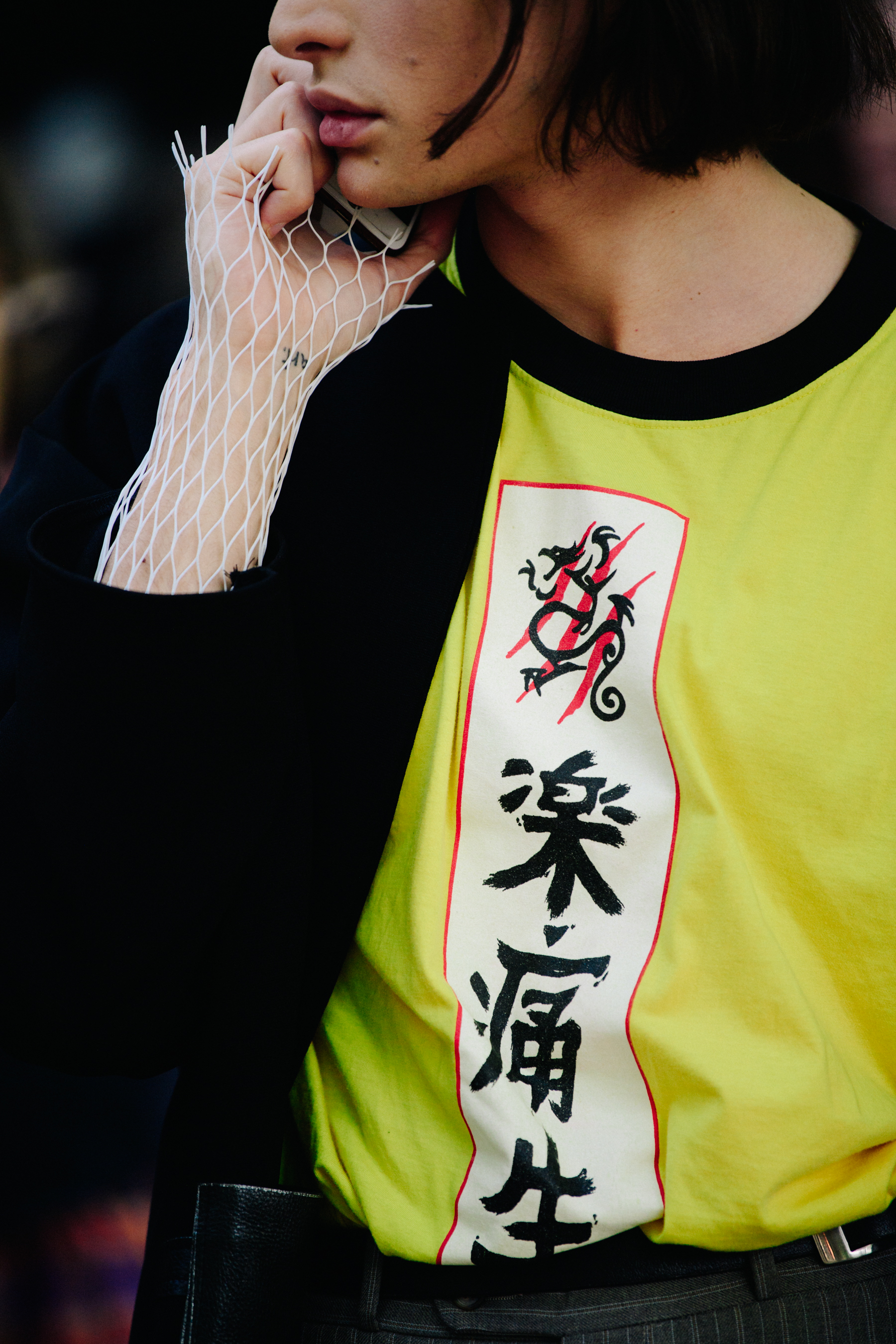 Man wearing yellow tee shirt