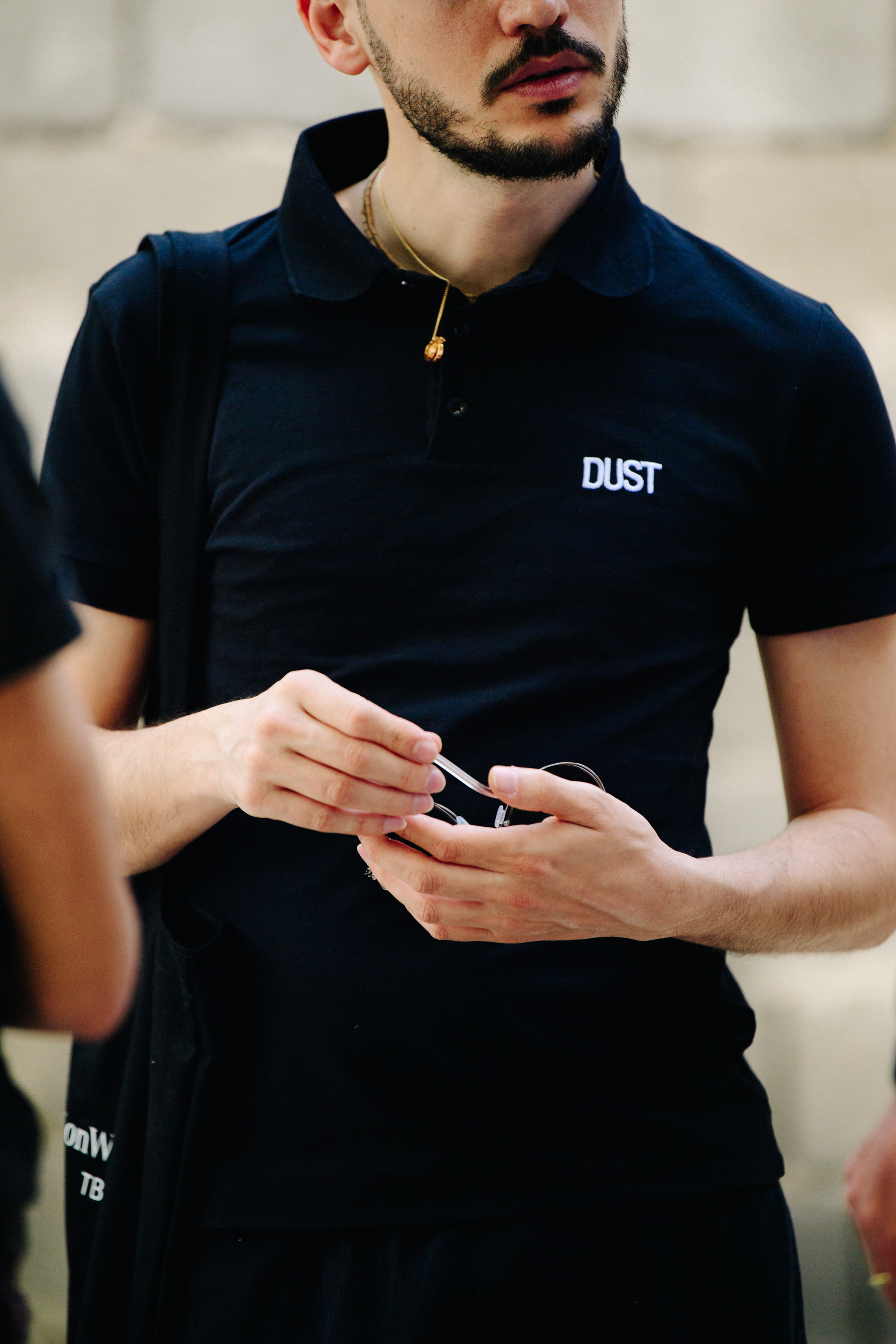 Man wearing black polo