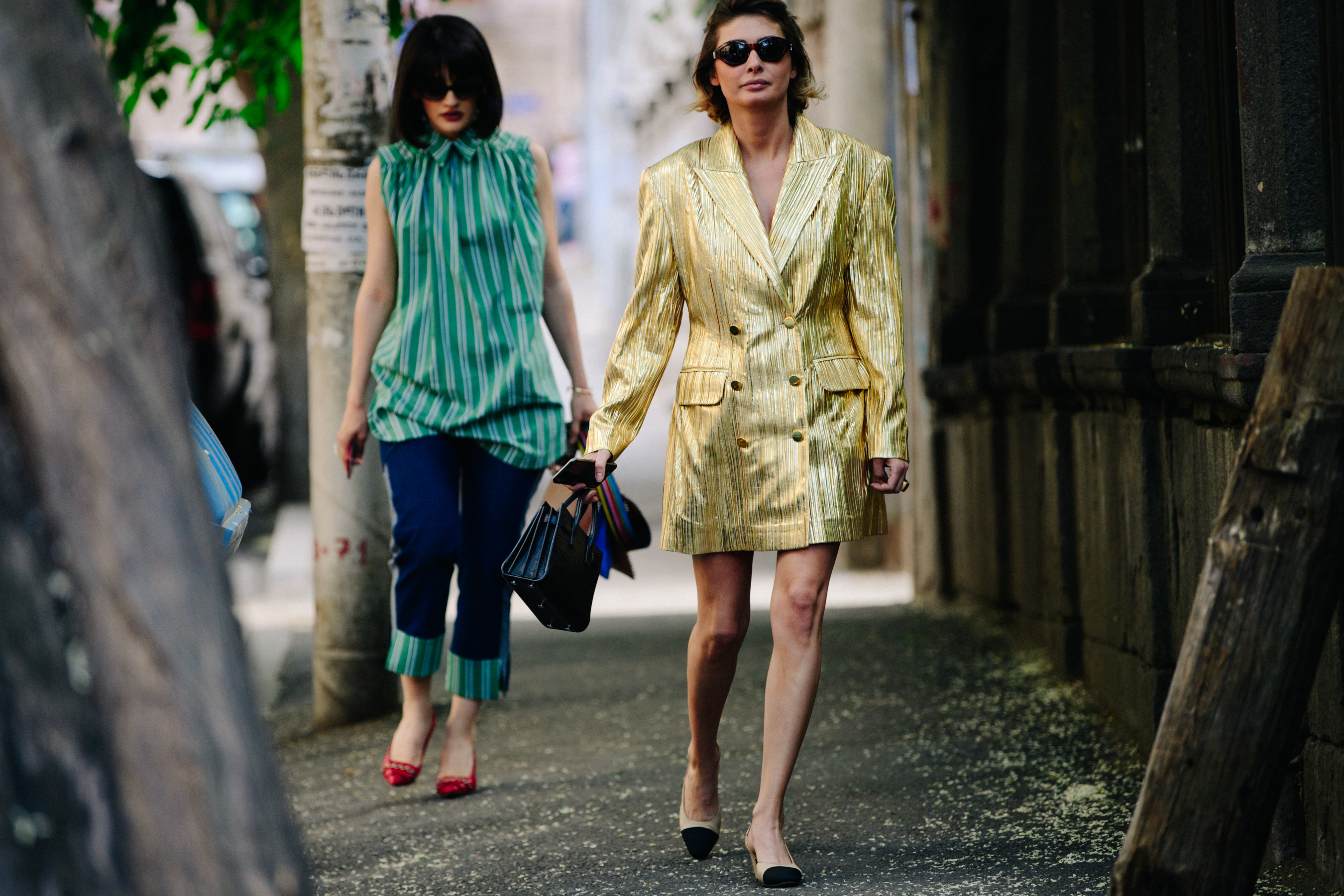 Two women wearing stylish outfits