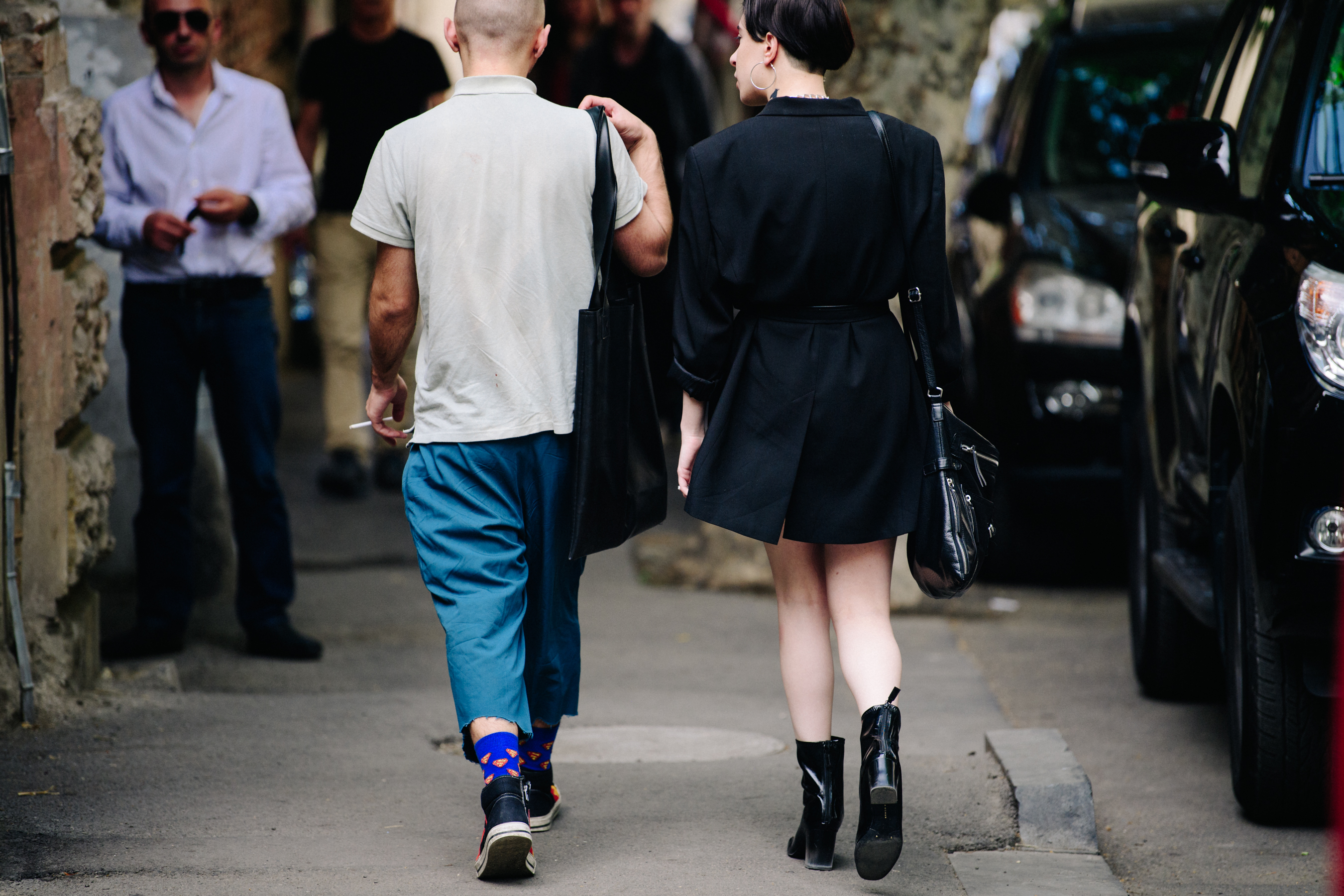 Couple wearing dark outfits