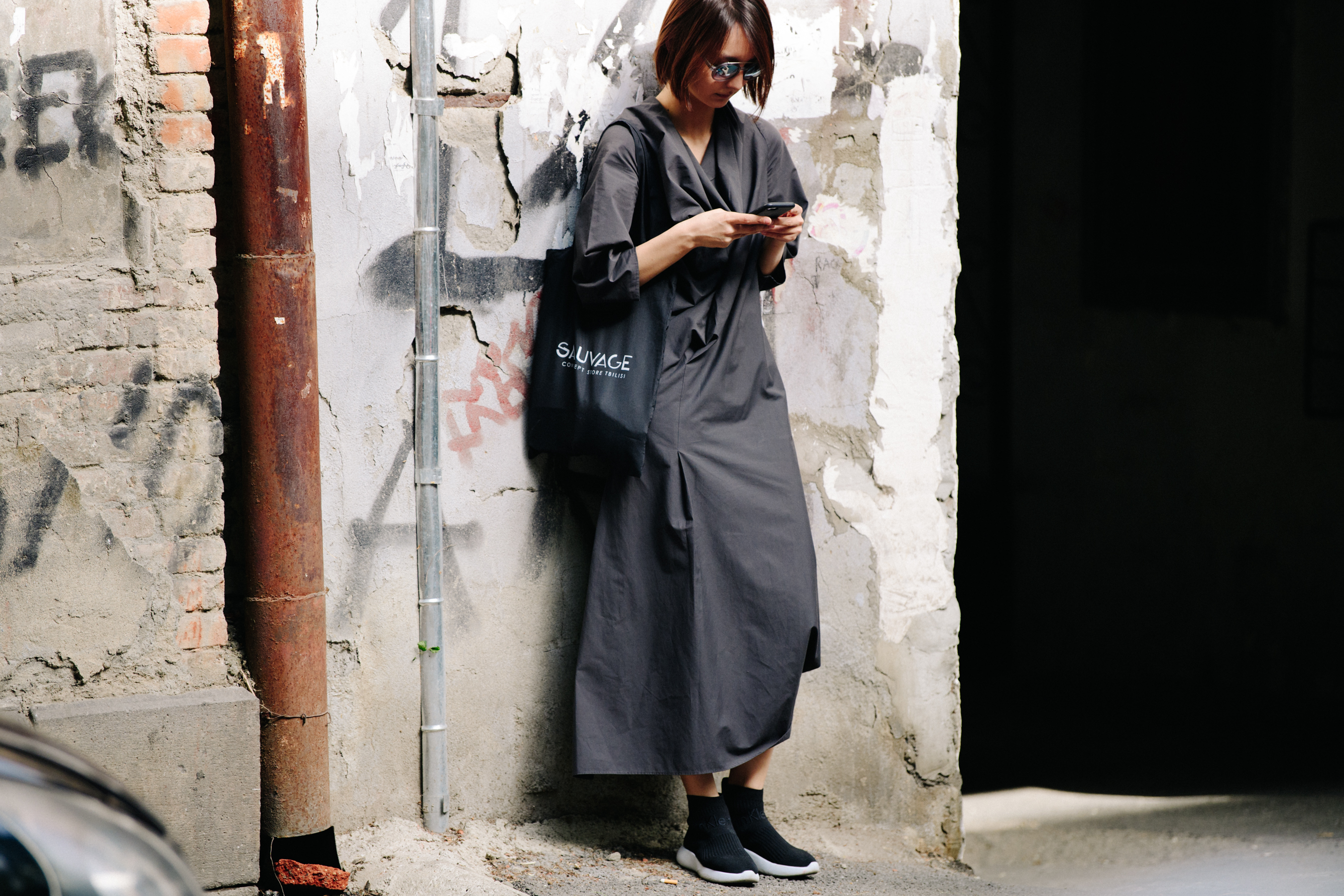 Woman wearing long grey dress