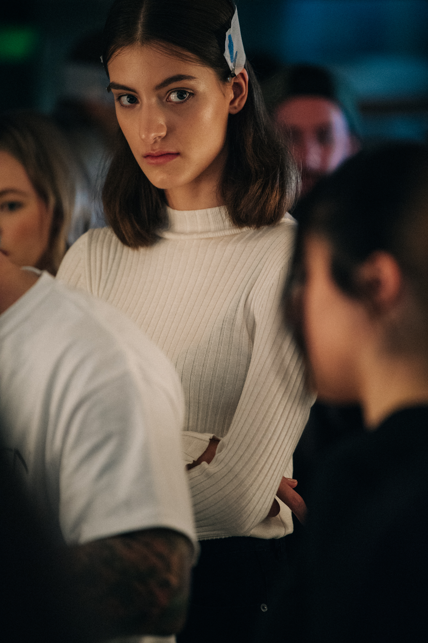 Model wearing white backstage