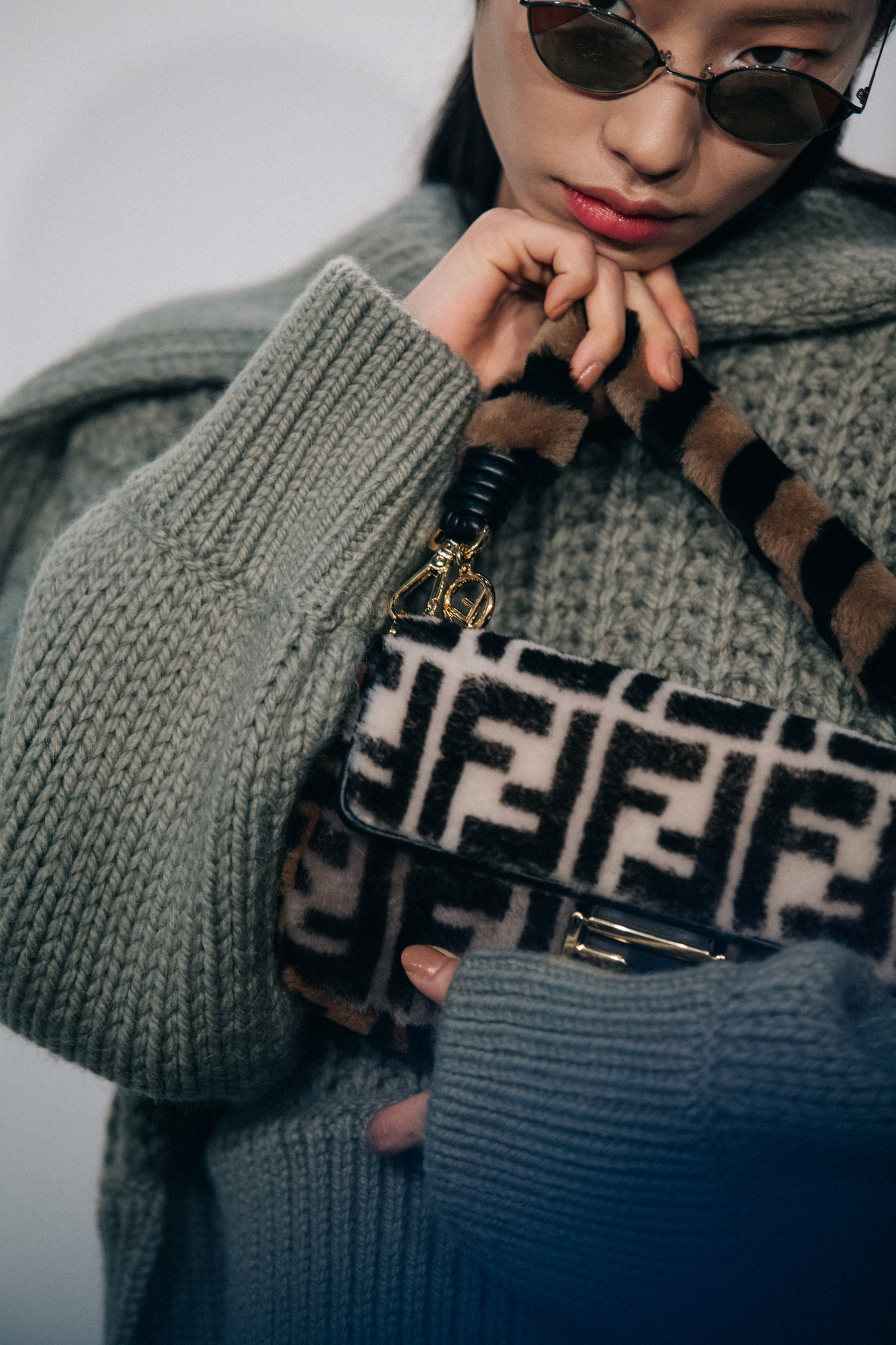 Model holding Fendi bag backstage