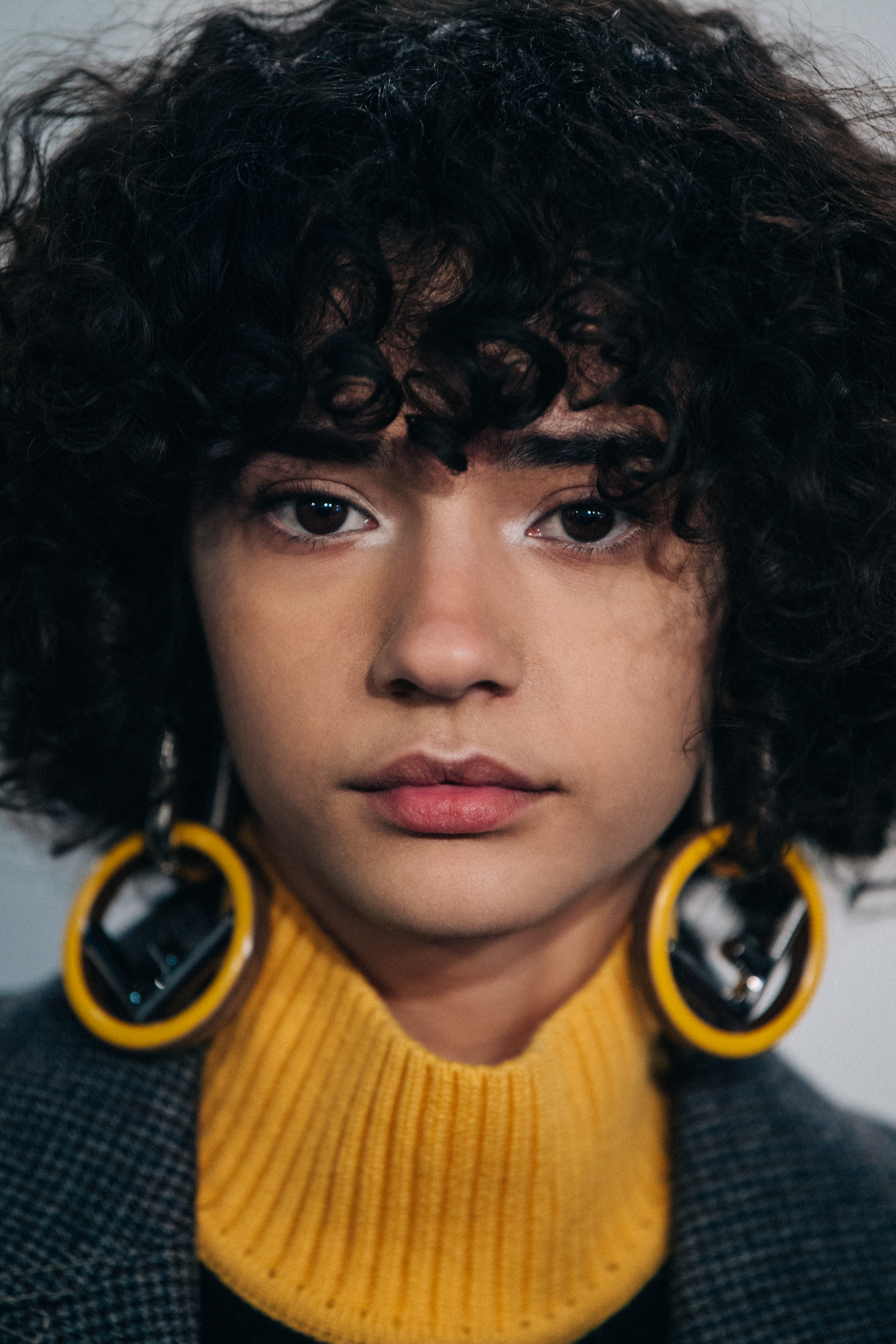 Portrait of model with short curly hair
