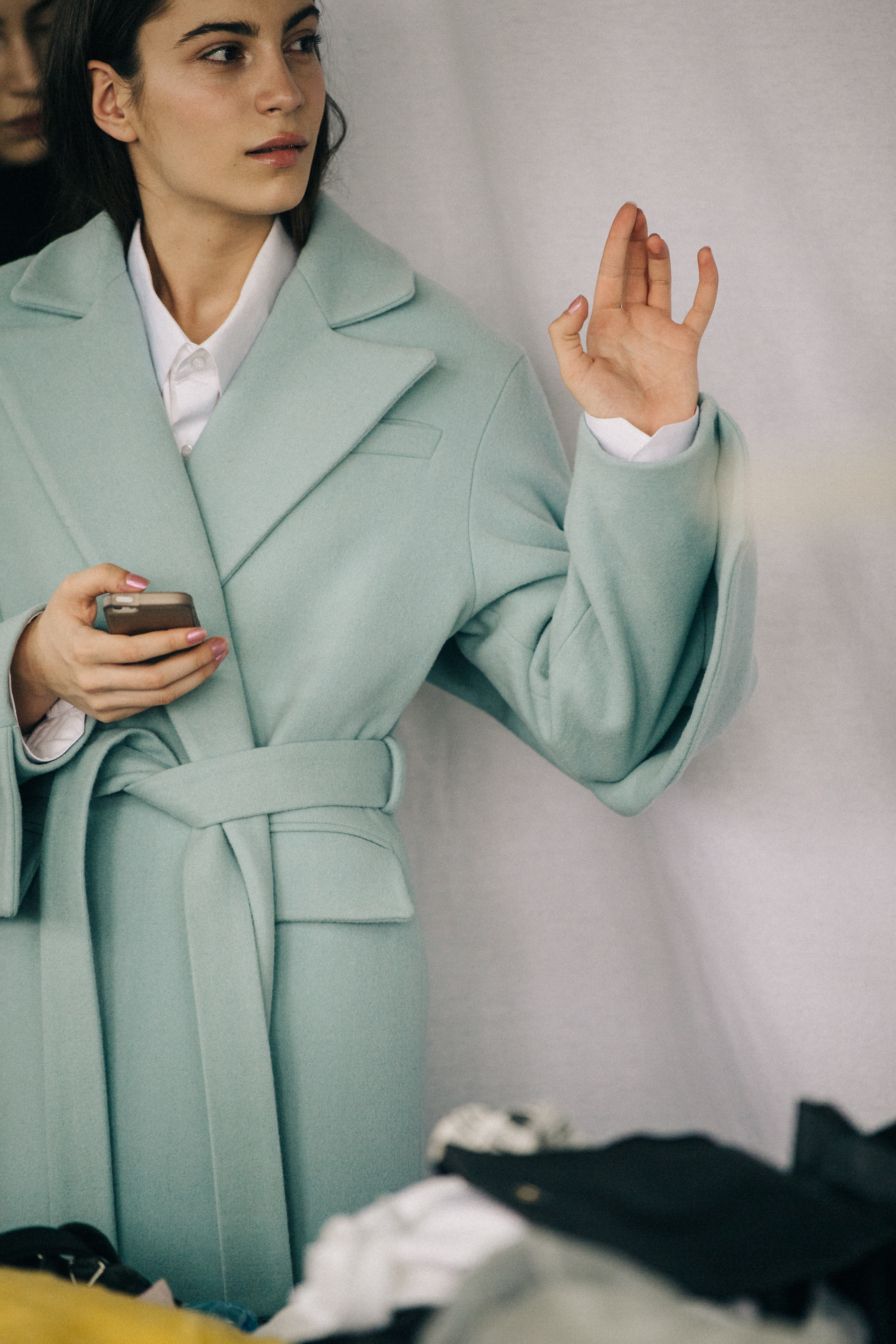 Model wearing blue coat