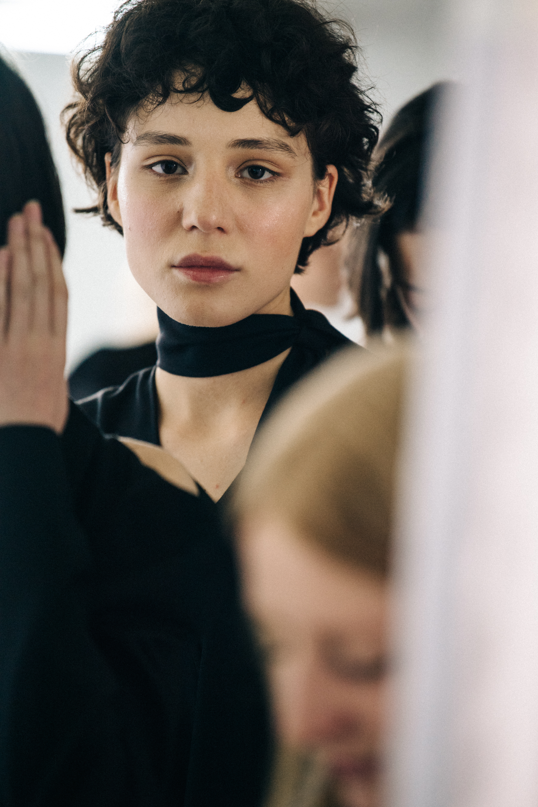 Model wearing black necktie